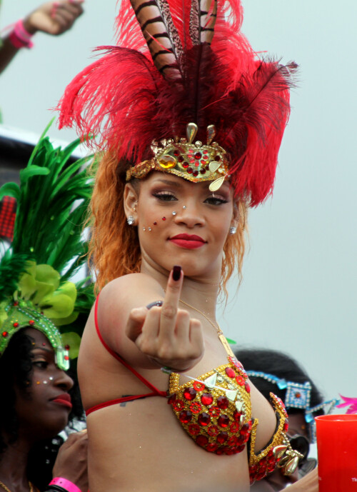 Rihanna showing middle finger

Rihanna returns to her hometown to take part in a Kadooment Day parade which was held in Barbados on August 1, 2011

Rihanna: Super Sexy for Kadooment Day Parade!

Rihanna wears a barely there bikini for a Kadooment Day parade held on Monday (August 1) in Barbados.

The 23-year-old singer arrived back in her hometown over the weekend after wrapping up the North American leg of her Loud tour.

FYI: Kadooment Day is the final day of the Crop Over traditional festival, which historically celebrated the end of the sugar cane harvest. Thousands of Barbadians join different bands with members dressed in elaborate costumes!