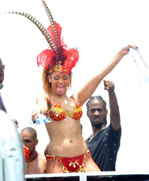 Rihanna returns to her hometown to take part in a Kadooment Day parade which was held in Barbados on August 1, 2011

Rihanna: Super Sexy for Kadooment Day Parade!

Rihanna wears a barely there bikini for a Kadooment Day parade held on Monday (August 1) in Barbados.

The 23-year-old singer arrived back in her hometown over the weekend after wrapping up the North American leg of her Loud tour.

FYI: Kadooment Day is the final day of the Crop Over traditional festival, which historically celebrated the end of the sugar cane harvest. Thousands of Barbadians join different bands with members dressed in elaborate costumes!