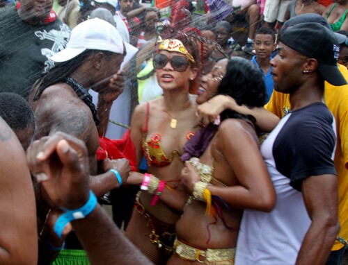 Rihanna returns to her hometown to take part in a Kadooment Day parade which was held in Barbados on August 1, 2011

Rihanna: Super Sexy for Kadooment Day Parade!

Rihanna wears a barely there bikini for a Kadooment Day parade held on Monday (August 1) in Barbados.

The 23-year-old singer arrived back in her hometown over the weekend after wrapping up the North American leg of her Loud tour.

FYI: Kadooment Day is the final day of the Crop Over traditional festival, which historically celebrated the end of the sugar cane harvest. Thousands of Barbadians join different bands with members dressed in elaborate costumes!