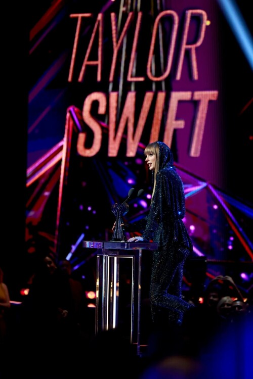 Taylor Swift - 2023 iHeartRadio Music Awards at Dolby Theatre in Hollywood - March 27, 2023

Taylor Swift sports sparkling jumpsuit at iHeartRadio Music Awards 2023

She’s in her innovator era.

Taylor Swift took a break from her Eras Tour to attend Monday night’s iHeartRadio Music Awards 2023, where she’s set to be honored with the Innovator Award during the ceremony.

And while she skipped the red carpet, the pop superstar popped up inside the ceremony, clad in a crystal-covered hooded jacket, pants and boots from Alexandre Vauthier Couture that lent the look of a jumpsuit (and could’ve been plucked straight from her “Reputation” era).

Swift wore her hair sleek and straight, completing her futuristic fashion moment with a silvery smoky eye, glossy nude lip and iridescent manicure, along with jewelry from KatKim and Anita Ko.

Per iHeartRadio’s press release, the Innovator Award is bestowed on an artist who has “impacted global pop culture throughout their career.”

Past recipients include Justin Timberlake, Pharrell Williams, U2, Bruno Mars, Chance the Rapper and Alicia Keys.

Phoebe Bridgers, Swift’s “Nothing New” collaborator and one of the opening acts on her Eras Tour, introduced her during the telecast.

Artists including Ed Sheeran, Selena Gomez, Justin Timberlake and Dolly Parton also spoke about her work and impact on the music industry in a video tribute that played before she took the stage to accept the honor.

Swift is among the night’s most nominated artists.

She’s up for a total of seven awards: Song of the Year, Best Lyrics and Best Music Video (all for “Anti-Hero”), TikTok Bop of the Year (“Bejeweled”), Favorite Use of a Sample (“Question…?”), Best Fan Army and Artist of the Year.

“I think the coolest ideas, motivations or choices are the ones that set a new precedent,” Swift said during her acceptance speech.

While she’s not scheduled to perform during the Lenny Kravitz-hosted ceremony, viewers can look forward to seeing Pink (who’s receiving the Icon Award), Kelly Clarkson, Keith Urban, Latto, Coldplay and Pat Benatar take the stage, among others.