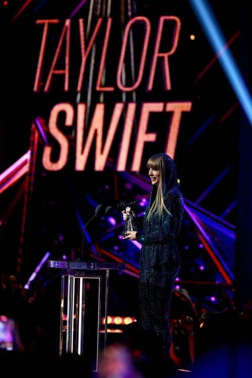 Taylor Swift - 2023 iHeartRadio Music Awards at Dolby Theatre in Hollywood - March 27, 2023

Taylor Swift sports sparkling jumpsuit at iHeartRadio Music Awards 2023

She’s in her innovator era.

Taylor Swift took a break from her Eras Tour to attend Monday night’s iHeartRadio Music Awards 2023, where she’s set to be honored with the Innovator Award during the ceremony.

And while she skipped the red carpet, the pop superstar popped up inside the ceremony, clad in a crystal-covered hooded jacket, pants and boots from Alexandre Vauthier Couture that lent the look of a jumpsuit (and could’ve been plucked straight from her “Reputation” era).

Swift wore her hair sleek and straight, completing her futuristic fashion moment with a silvery smoky eye, glossy nude lip and iridescent manicure, along with jewelry from KatKim and Anita Ko.

Per iHeartRadio’s press release, the Innovator Award is bestowed on an artist who has “impacted global pop culture throughout their career.”

Past recipients include Justin Timberlake, Pharrell Williams, U2, Bruno Mars, Chance the Rapper and Alicia Keys.

Phoebe Bridgers, Swift’s “Nothing New” collaborator and one of the opening acts on her Eras Tour, introduced her during the telecast.

Artists including Ed Sheeran, Selena Gomez, Justin Timberlake and Dolly Parton also spoke about her work and impact on the music industry in a video tribute that played before she took the stage to accept the honor.

Swift is among the night’s most nominated artists.

She’s up for a total of seven awards: Song of the Year, Best Lyrics and Best Music Video (all for “Anti-Hero”), TikTok Bop of the Year (“Bejeweled”), Favorite Use of a Sample (“Question…?”), Best Fan Army and Artist of the Year.

“I think the coolest ideas, motivations or choices are the ones that set a new precedent,” Swift said during her acceptance speech.

While she’s not scheduled to perform during the Lenny Kravitz-hosted ceremony, viewers can look forward to seeing Pink (who’s receiving the Icon Award), Kelly Clarkson, Keith Urban, Latto, Coldplay and Pat Benatar take the stage, among others.