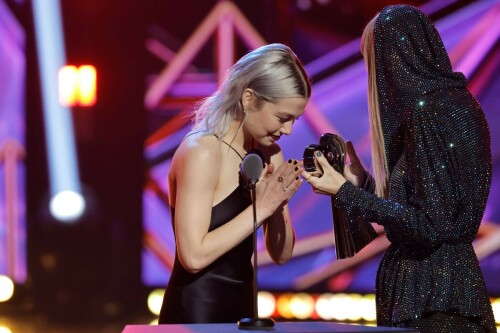 Taylor Swift - 2023 iHeartRadio Music Awards at Dolby Theatre in Hollywood - March 27, 2023

Taylor Swift sports sparkling jumpsuit at iHeartRadio Music Awards 2023

She’s in her innovator era.

Taylor Swift took a break from her Eras Tour to attend Monday night’s iHeartRadio Music Awards 2023, where she’s set to be honored with the Innovator Award during the ceremony.

And while she skipped the red carpet, the pop superstar popped up inside the ceremony, clad in a crystal-covered hooded jacket, pants and boots from Alexandre Vauthier Couture that lent the look of a jumpsuit (and could’ve been plucked straight from her “Reputation” era).

Swift wore her hair sleek and straight, completing her futuristic fashion moment with a silvery smoky eye, glossy nude lip and iridescent manicure, along with jewelry from KatKim and Anita Ko.

Per iHeartRadio’s press release, the Innovator Award is bestowed on an artist who has “impacted global pop culture throughout their career.”

Past recipients include Justin Timberlake, Pharrell Williams, U2, Bruno Mars, Chance the Rapper and Alicia Keys.

Phoebe Bridgers, Swift’s “Nothing New” collaborator and one of the opening acts on her Eras Tour, introduced her during the telecast.

Artists including Ed Sheeran, Selena Gomez, Justin Timberlake and Dolly Parton also spoke about her work and impact on the music industry in a video tribute that played before she took the stage to accept the honor.

Swift is among the night’s most nominated artists.

She’s up for a total of seven awards: Song of the Year, Best Lyrics and Best Music Video (all for “Anti-Hero”), TikTok Bop of the Year (“Bejeweled”), Favorite Use of a Sample (“Question…?”), Best Fan Army and Artist of the Year.

“I think the coolest ideas, motivations or choices are the ones that set a new precedent,” Swift said during her acceptance speech.

While she’s not scheduled to perform during the Lenny Kravitz-hosted ceremony, viewers can look forward to seeing Pink (who’s receiving the Icon Award), Kelly Clarkson, Keith Urban, Latto, Coldplay and Pat Benatar take the stage, among others.