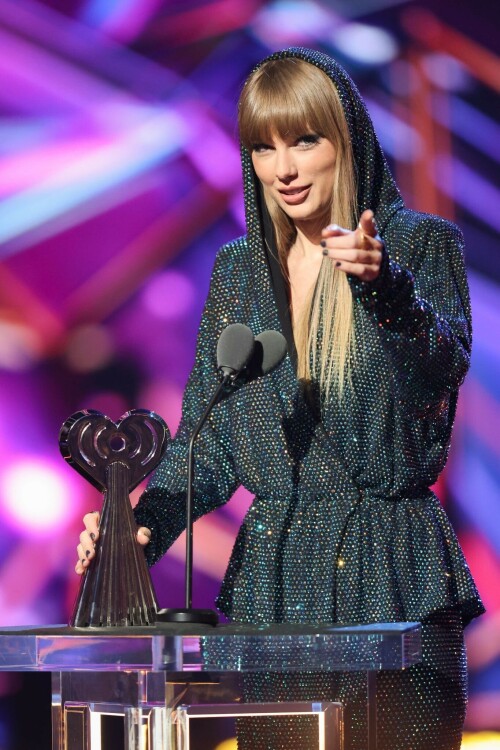 Taylor Swift - 2023 iHeartRadio Music Awards at Dolby Theatre in Hollywood - March 27, 2023

Taylor Swift sports sparkling jumpsuit at iHeartRadio Music Awards 2023

She’s in her innovator era.

Taylor Swift took a break from her Eras Tour to attend Monday night’s iHeartRadio Music Awards 2023, where she’s set to be honored with the Innovator Award during the ceremony.

And while she skipped the red carpet, the pop superstar popped up inside the ceremony, clad in a crystal-covered hooded jacket, pants and boots from Alexandre Vauthier Couture that lent the look of a jumpsuit (and could’ve been plucked straight from her “Reputation” era).

Swift wore her hair sleek and straight, completing her futuristic fashion moment with a silvery smoky eye, glossy nude lip and iridescent manicure, along with jewelry from KatKim and Anita Ko.

Per iHeartRadio’s press release, the Innovator Award is bestowed on an artist who has “impacted global pop culture throughout their career.”

Past recipients include Justin Timberlake, Pharrell Williams, U2, Bruno Mars, Chance the Rapper and Alicia Keys.

Phoebe Bridgers, Swift’s “Nothing New” collaborator and one of the opening acts on her Eras Tour, introduced her during the telecast.

Artists including Ed Sheeran, Selena Gomez, Justin Timberlake and Dolly Parton also spoke about her work and impact on the music industry in a video tribute that played before she took the stage to accept the honor.

Swift is among the night’s most nominated artists.

She’s up for a total of seven awards: Song of the Year, Best Lyrics and Best Music Video (all for “Anti-Hero”), TikTok Bop of the Year (“Bejeweled”), Favorite Use of a Sample (“Question…?”), Best Fan Army and Artist of the Year.

“I think the coolest ideas, motivations or choices are the ones that set a new precedent,” Swift said during her acceptance speech.

While she’s not scheduled to perform during the Lenny Kravitz-hosted ceremony, viewers can look forward to seeing Pink (who’s receiving the Icon Award), Kelly Clarkson, Keith Urban, Latto, Coldplay and Pat Benatar take the stage, among others.