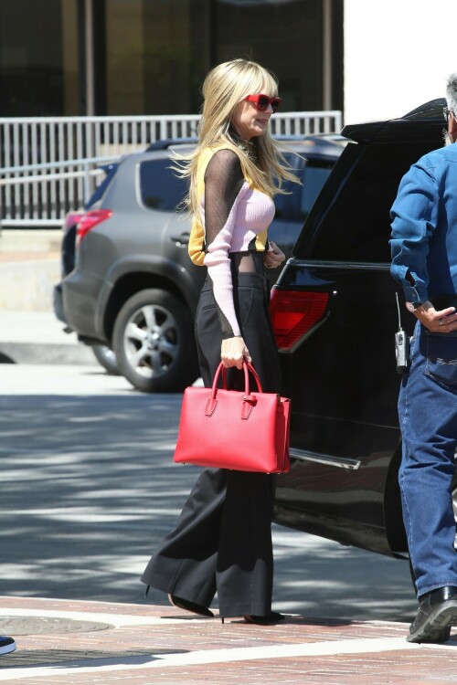 Heidi Klum is seen on March 28, 2023 in Los Angeles, CA.

Her celebrity style: Camila Coelho Raina Top, Monse Corset-Style High-Waist Trousers, Kilian Kerner x Fielmann 018 Fa Sunglasses, MCM Milla Tote Bag in Ruby Red

#HeidiKlum