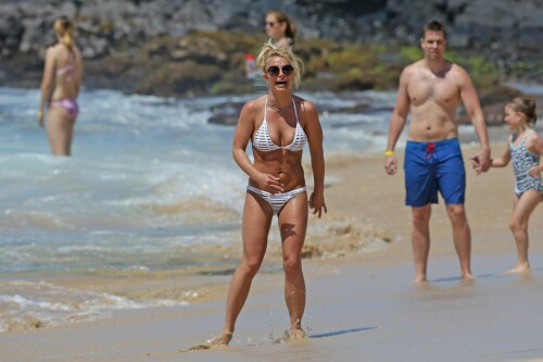 Britney Spears In A White Bikini Beach Fun in Kauai, Hawaii - April 2017

Britney Spears' Abs Are Having Their Best Week Ever

The pop star has been finding new ways to show off her midriff every single day

 It’s no accident that Britney Spears has been a world renowned pop star for coming up on 20 years now. The “Slave 4 U” singer knows that if you want to stay at the top of your game and compete with the best in the business, you’ve got to put in some serious work. That means, a lot of late nights in the studio, fittings, long rehearsals every single day, endless choreography, and of course, some serious hours logged at the gym.

Spears has clearly been taking this very seriously as she’s been proving in one bikini after the next that her body has truly never looked better. And if you are putting in all of the time to look so good, you might as well show it off, which is exactly what Britney has been up to, celebrating her abs this week in a constant parade of midriff-centric outfits.

Another day, another bikini-clad selfie seems to be the motto of this pop star’s life, especially during her current family vacation in Hawaii. The 35-year-old took her two boys and her mother, Lynne Spears, with her to the beach for a bout of wake boarding, posing for a family photo wearing a coral pink string bikini, a bead necklace, mirrored aviators, and a pair of black Birkenstocks.