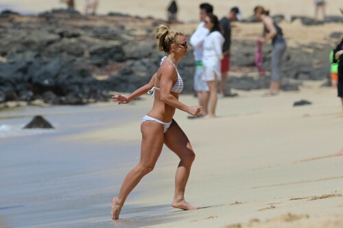 Britney Spears In A White Bikini Beach Fun in Kauai, Hawaii - April 2017

Britney Spears' Abs Are Having Their Best Week Ever

The pop star has been finding new ways to show off her midriff every single day

 It’s no accident that Britney Spears has been a world renowned pop star for coming up on 20 years now. The “Slave 4 U” singer knows that if you want to stay at the top of your game and compete with the best in the business, you’ve got to put in some serious work. That means, a lot of late nights in the studio, fittings, long rehearsals every single day, endless choreography, and of course, some serious hours logged at the gym.

Spears has clearly been taking this very seriously as she’s been proving in one bikini after the next that her body has truly never looked better. And if you are putting in all of the time to look so good, you might as well show it off, which is exactly what Britney has been up to, celebrating her abs this week in a constant parade of midriff-centric outfits.

Another day, another bikini-clad selfie seems to be the motto of this pop star’s life, especially during her current family vacation in Hawaii. The 35-year-old took her two boys and her mother, Lynne Spears, with her to the beach for a bout of wake boarding, posing for a family photo wearing a coral pink string bikini, a bead necklace, mirrored aviators, and a pair of black Birkenstocks.