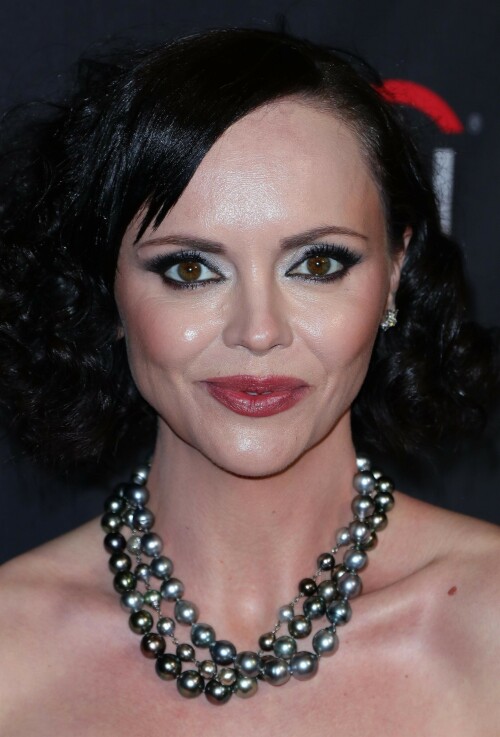 Actress Christina Ricci attends PaleyFest LA 2023 - 'Yellowjackets' at Dolby Theatre in Hollywood, California - April 3, 2023

Christina Ricci Goes Black and Pink in Strapless Jumpsuit at ‘Yellowjackets’ PaleyFest ScreeningThe actress is continuing to promote the second season of her hit Showtime series.

Christina Ricci arrived on the red carpet for the PaleyFest screening of her hit Showtime series “Yellowjackets” on Monday in Los Angeles.

The actress wore a black and pink-patterned jumpsuit. She paired the strapless piece with pointy-toe black platform heels and accessorized with a pair of pearl necklaces.

Ricci regularly works with celebrity stylist Cristina Ehrlich, who also works with Allison Williams, Hannah Waddingham and Trinity Bliss.

On March 22, Ricci attended the world premiere of “Yellowjackets” season two wearing a sleeveless black dress with a high neckline from Fendi. On March 14, for her appearance on “The Late Show With Stephen Colbert,” she wore a sleeveless black dress with side ruching on the skirt from Wolk Morais.

Ricci first came to fame as a child actress when she starred as Wednesday Addams in the 1991 film “The Addams Family” and its 1993 sequel “Addams Family Values.” Ricci returned to the “Addams Family” universe for “Wednesday,” playing the character Marilyn Thornhill. The series became the second most-watched English language Netflix series.

In November, she attended the “Wednesday” premiere wearing a sleeveless black gown with a sheer bodice, ruffle trims around the neckline and shoulders, a tiered skirt and a spiderweb pattern embroidered into the bodice from Rodarte.

Showtime drama “Yellowjackets” chronicles the lives of former teen soccer players who previously lived in the wilderness for 19 months. A hit upon its 2021 release, the program’s second season premiered on March 26. Stars include Ricci, Juliette Lewis, Melanie Lynskey, Tawny Cypress, Jasmin Savoy Brown and Steven Krueger, while new cast members include Elijah Wood, Simone Kessell and Lauren Ambrose.