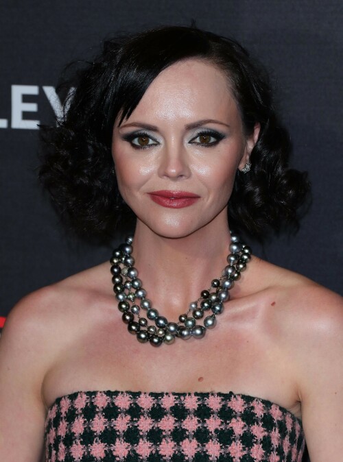 Actress Christina Ricci attends PaleyFest LA 2023 - 'Yellowjackets' at Dolby Theatre in Hollywood, California - April 3, 2023

Christina Ricci Goes Black and Pink in Strapless Jumpsuit at ‘Yellowjackets’ PaleyFest ScreeningThe actress is continuing to promote the second season of her hit Showtime series.

Christina Ricci arrived on the red carpet for the PaleyFest screening of her hit Showtime series “Yellowjackets” on Monday in Los Angeles.

The actress wore a black and pink-patterned jumpsuit. She paired the strapless piece with pointy-toe black platform heels and accessorized with a pair of pearl necklaces.

Ricci regularly works with celebrity stylist Cristina Ehrlich, who also works with Allison Williams, Hannah Waddingham and Trinity Bliss.

On March 22, Ricci attended the world premiere of “Yellowjackets” season two wearing a sleeveless black dress with a high neckline from Fendi. On March 14, for her appearance on “The Late Show With Stephen Colbert,” she wore a sleeveless black dress with side ruching on the skirt from Wolk Morais.

Ricci first came to fame as a child actress when she starred as Wednesday Addams in the 1991 film “The Addams Family” and its 1993 sequel “Addams Family Values.” Ricci returned to the “Addams Family” universe for “Wednesday,” playing the character Marilyn Thornhill. The series became the second most-watched English language Netflix series.

In November, she attended the “Wednesday” premiere wearing a sleeveless black gown with a sheer bodice, ruffle trims around the neckline and shoulders, a tiered skirt and a spiderweb pattern embroidered into the bodice from Rodarte.

Showtime drama “Yellowjackets” chronicles the lives of former teen soccer players who previously lived in the wilderness for 19 months. A hit upon its 2021 release, the program’s second season premiered on March 26. Stars include Ricci, Juliette Lewis, Melanie Lynskey, Tawny Cypress, Jasmin Savoy Brown and Steven Krueger, while new cast members include Elijah Wood, Simone Kessell and Lauren Ambrose.