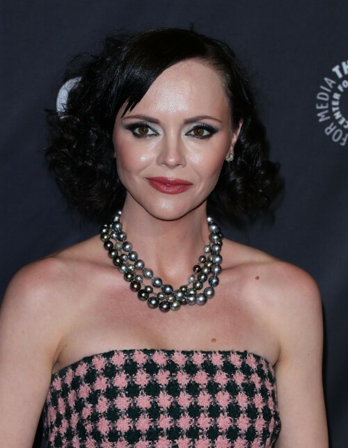 Actress Christina Ricci attends PaleyFest LA 2023 - 'Yellowjackets' at Dolby Theatre in Hollywood, California - April 3, 2023

Christina Ricci Goes Black and Pink in Strapless Jumpsuit at ‘Yellowjackets’ PaleyFest ScreeningThe actress is continuing to promote the second season of her hit Showtime series.

Christina Ricci arrived on the red carpet for the PaleyFest screening of her hit Showtime series “Yellowjackets” on Monday in Los Angeles.

The actress wore a black and pink-patterned jumpsuit. She paired the strapless piece with pointy-toe black platform heels and accessorized with a pair of pearl necklaces.

Ricci regularly works with celebrity stylist Cristina Ehrlich, who also works with Allison Williams, Hannah Waddingham and Trinity Bliss.

On March 22, Ricci attended the world premiere of “Yellowjackets” season two wearing a sleeveless black dress with a high neckline from Fendi. On March 14, for her appearance on “The Late Show With Stephen Colbert,” she wore a sleeveless black dress with side ruching on the skirt from Wolk Morais.

Ricci first came to fame as a child actress when she starred as Wednesday Addams in the 1991 film “The Addams Family” and its 1993 sequel “Addams Family Values.” Ricci returned to the “Addams Family” universe for “Wednesday,” playing the character Marilyn Thornhill. The series became the second most-watched English language Netflix series.

In November, she attended the “Wednesday” premiere wearing a sleeveless black gown with a sheer bodice, ruffle trims around the neckline and shoulders, a tiered skirt and a spiderweb pattern embroidered into the bodice from Rodarte.

Showtime drama “Yellowjackets” chronicles the lives of former teen soccer players who previously lived in the wilderness for 19 months. A hit upon its 2021 release, the program’s second season premiered on March 26. Stars include Ricci, Juliette Lewis, Melanie Lynskey, Tawny Cypress, Jasmin Savoy Brown and Steven Krueger, while new cast members include Elijah Wood, Simone Kessell and Lauren Ambrose.