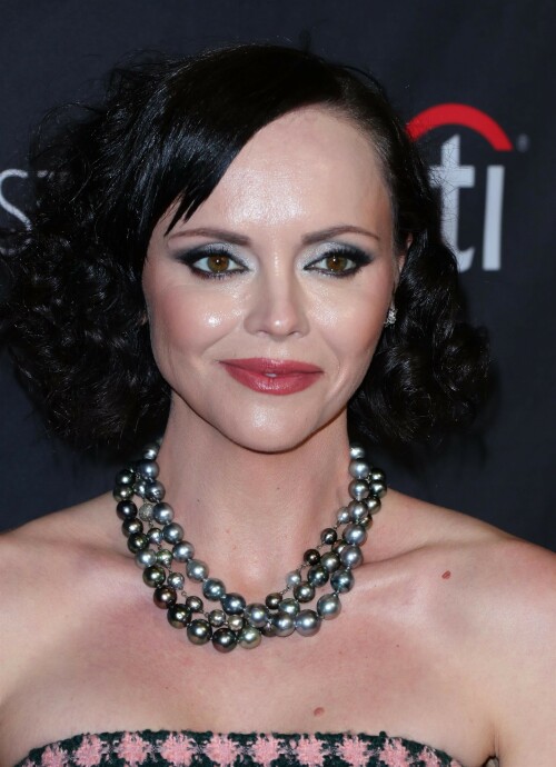 Actress Christina Ricci attends PaleyFest LA 2023 - 'Yellowjackets' at Dolby Theatre in Hollywood, California - April 3, 2023

Christina Ricci Goes Black and Pink in Strapless Jumpsuit at ‘Yellowjackets’ PaleyFest ScreeningThe actress is continuing to promote the second season of her hit Showtime series.

Christina Ricci arrived on the red carpet for the PaleyFest screening of her hit Showtime series “Yellowjackets” on Monday in Los Angeles.

The actress wore a black and pink-patterned jumpsuit. She paired the strapless piece with pointy-toe black platform heels and accessorized with a pair of pearl necklaces.

Ricci regularly works with celebrity stylist Cristina Ehrlich, who also works with Allison Williams, Hannah Waddingham and Trinity Bliss.

On March 22, Ricci attended the world premiere of “Yellowjackets” season two wearing a sleeveless black dress with a high neckline from Fendi. On March 14, for her appearance on “The Late Show With Stephen Colbert,” she wore a sleeveless black dress with side ruching on the skirt from Wolk Morais.

Ricci first came to fame as a child actress when she starred as Wednesday Addams in the 1991 film “The Addams Family” and its 1993 sequel “Addams Family Values.” Ricci returned to the “Addams Family” universe for “Wednesday,” playing the character Marilyn Thornhill. The series became the second most-watched English language Netflix series.

In November, she attended the “Wednesday” premiere wearing a sleeveless black gown with a sheer bodice, ruffle trims around the neckline and shoulders, a tiered skirt and a spiderweb pattern embroidered into the bodice from Rodarte.

Showtime drama “Yellowjackets” chronicles the lives of former teen soccer players who previously lived in the wilderness for 19 months. A hit upon its 2021 release, the program’s second season premiered on March 26. Stars include Ricci, Juliette Lewis, Melanie Lynskey, Tawny Cypress, Jasmin Savoy Brown and Steven Krueger, while new cast members include Elijah Wood, Simone Kessell and Lauren Ambrose.