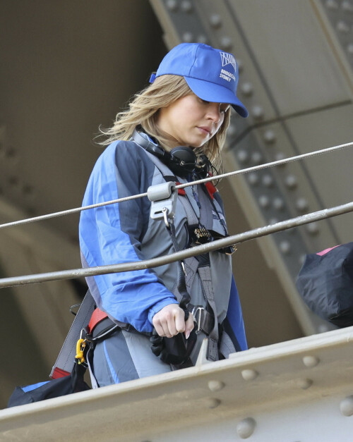 Euphoria Star Sydney Sweeney Spends Easter Holiday Climbing Sydney Harbour Bridge

Sydney Sweeney is currently shooting a new romantic comedy in Australia.

On Easter Sunday, the actress spent her day off climbing the Sydney Harbor Bridge alongside her co-star, Glen Powell, 34.

The Euphoria star shone as she took in the breathtaking view from far above the city.

The 25-year-old was decked out in a climbing suit in shades of gray and blue and a safety harness.

She completed her look with a baby cap and minimal make-up for the strenuous climb.

Sydney Sweeney is currently shooting a new romantic comedy in Australia

On Easter Sunday, the actress spent her day off climbing the Sydney Harbor Bridge alongside her co-star, Glen Powell

The Euphoria star shone as she took in the breathtaking view from far above the city

The beauty had her blonde locks around her face and a pair of headphones around her neck.

Glen opted for the same ensemble, with a classic climbing suit and matching blue cap.

Last month, the two took a break from filming to visit the Taronga Zoo together and feed giraffes.

Sydney has been Down Under for several weeks now and last week visited another popular tourist spot – Luna Park.

A guide led the actress up the many steps to the top of the bridge

She has filmed in locations around the city, including the inner-city suburb of Surry Hills and Double Bay, in the east of the city.

The yet-to-be-titled romantic comedy is directed by Will Gluck, who helmed the romantic comedies Easy A and Friends With Benefits.

Details about the plot of the R-rated movie are being kept under wraps, but the movie will also star Bryan Brown, Michelle Hurd, Hadley Robinson, and Darren Barnet.

The project is expected to bring in AUD$41 million to the local New South Wales economy and create more than 440 jobs for cast and crew.

Details about the plot of the R-rated movie are being kept under wraps, but the movie will also star Bryan Brown, Michelle Hurd, Hadley Robinson and Darren Barnet

The actress is best known for starring in The White Lotus and playing Cassie Howard on the HBO hit show Euphoria.

Sydney is engaged to Jonathan Davino, 37, a millionaire restaurant owner. The couple confirmed their engagement to People in March last year.

Sweeney and her fiancé were first spotted in each other’s company in 2018.

The actress made a rare statement about her love life during an interview with Cosmopolitan last year, saying she wasn’t romantically interested in anyone who works in the entertainment industry.

Maverick star Glen was spotted picking up his gorgeous model girlfriend Gigi Paris from the airport in Australia last month, while Gigi came to visit him on location

“I don’t date people who are in the spotlight. I don’t date actors or musicians or anyone in the entertainment business because that way I can just be normal Syd and it’s easiest. I have a great support system,” she said.

The artist did speak about the qualities she was looking for in a partner.

‘I’m looking for a best friend. I need to be able to be with someone who I can hang out with literally 24/7 and who I never tire of and who we laugh about every day,” she said.

Maverick star Glen was spotted last month picking up his gorgeous model girlfriend Gigi Paris from the airport in Australia, while Gigi came to visit him on location.