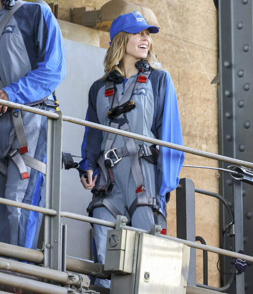 Euphoria Star Sydney Sweeney Spends Easter Holiday Climbing Sydney Harbour Bridge

Sydney Sweeney is currently shooting a new romantic comedy in Australia.

On Easter Sunday, the actress spent her day off climbing the Sydney Harbor Bridge alongside her co-star, Glen Powell, 34.

The Euphoria star shone as she took in the breathtaking view from far above the city.

The 25-year-old was decked out in a climbing suit in shades of gray and blue and a safety harness.

She completed her look with a baby cap and minimal make-up for the strenuous climb.

Sydney Sweeney is currently shooting a new romantic comedy in Australia

On Easter Sunday, the actress spent her day off climbing the Sydney Harbor Bridge alongside her co-star, Glen Powell

The Euphoria star shone as she took in the breathtaking view from far above the city

The beauty had her blonde locks around her face and a pair of headphones around her neck.

Glen opted for the same ensemble, with a classic climbing suit and matching blue cap.

Last month, the two took a break from filming to visit the Taronga Zoo together and feed giraffes.

Sydney has been Down Under for several weeks now and last week visited another popular tourist spot – Luna Park.

A guide led the actress up the many steps to the top of the bridge

She has filmed in locations around the city, including the inner-city suburb of Surry Hills and Double Bay, in the east of the city.

The yet-to-be-titled romantic comedy is directed by Will Gluck, who helmed the romantic comedies Easy A and Friends With Benefits.

Details about the plot of the R-rated movie are being kept under wraps, but the movie will also star Bryan Brown, Michelle Hurd, Hadley Robinson, and Darren Barnet.

The project is expected to bring in AUD$41 million to the local New South Wales economy and create more than 440 jobs for cast and crew.

Details about the plot of the R-rated movie are being kept under wraps, but the movie will also star Bryan Brown, Michelle Hurd, Hadley Robinson and Darren Barnet

The actress is best known for starring in The White Lotus and playing Cassie Howard on the HBO hit show Euphoria.

Sydney is engaged to Jonathan Davino, 37, a millionaire restaurant owner. The couple confirmed their engagement to People in March last year.

Sweeney and her fiancé were first spotted in each other’s company in 2018.

The actress made a rare statement about her love life during an interview with Cosmopolitan last year, saying she wasn’t romantically interested in anyone who works in the entertainment industry.

Maverick star Glen was spotted picking up his gorgeous model girlfriend Gigi Paris from the airport in Australia last month, while Gigi came to visit him on location

“I don’t date people who are in the spotlight. I don’t date actors or musicians or anyone in the entertainment business because that way I can just be normal Syd and it’s easiest. I have a great support system,” she said.

The artist did speak about the qualities she was looking for in a partner.

‘I’m looking for a best friend. I need to be able to be with someone who I can hang out with literally 24/7 and who I never tire of and who we laugh about every day,” she said.

Maverick star Glen was spotted last month picking up his gorgeous model girlfriend Gigi Paris from the airport in Australia, while Gigi came to visit him on location.