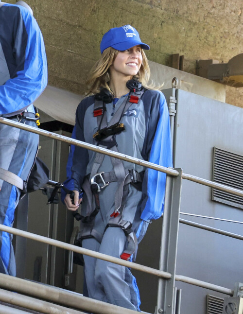 Euphoria Star Sydney Sweeney Spends Easter Holiday Climbing Sydney Harbour Bridge

Sydney Sweeney is currently shooting a new romantic comedy in Australia.

On Easter Sunday, the actress spent her day off climbing the Sydney Harbor Bridge alongside her co-star, Glen Powell, 34.

The Euphoria star shone as she took in the breathtaking view from far above the city.

The 25-year-old was decked out in a climbing suit in shades of gray and blue and a safety harness.

She completed her look with a baby cap and minimal make-up for the strenuous climb.

Sydney Sweeney is currently shooting a new romantic comedy in Australia

On Easter Sunday, the actress spent her day off climbing the Sydney Harbor Bridge alongside her co-star, Glen Powell

The Euphoria star shone as she took in the breathtaking view from far above the city

The beauty had her blonde locks around her face and a pair of headphones around her neck.

Glen opted for the same ensemble, with a classic climbing suit and matching blue cap.

Last month, the two took a break from filming to visit the Taronga Zoo together and feed giraffes.

Sydney has been Down Under for several weeks now and last week visited another popular tourist spot – Luna Park.

A guide led the actress up the many steps to the top of the bridge

She has filmed in locations around the city, including the inner-city suburb of Surry Hills and Double Bay, in the east of the city.

The yet-to-be-titled romantic comedy is directed by Will Gluck, who helmed the romantic comedies Easy A and Friends With Benefits.

Details about the plot of the R-rated movie are being kept under wraps, but the movie will also star Bryan Brown, Michelle Hurd, Hadley Robinson, and Darren Barnet.

The project is expected to bring in AUD$41 million to the local New South Wales economy and create more than 440 jobs for cast and crew.

Details about the plot of the R-rated movie are being kept under wraps, but the movie will also star Bryan Brown, Michelle Hurd, Hadley Robinson and Darren Barnet

The actress is best known for starring in The White Lotus and playing Cassie Howard on the HBO hit show Euphoria.

Sydney is engaged to Jonathan Davino, 37, a millionaire restaurant owner. The couple confirmed their engagement to People in March last year.

Sweeney and her fiancé were first spotted in each other’s company in 2018.

The actress made a rare statement about her love life during an interview with Cosmopolitan last year, saying she wasn’t romantically interested in anyone who works in the entertainment industry.

Maverick star Glen was spotted picking up his gorgeous model girlfriend Gigi Paris from the airport in Australia last month, while Gigi came to visit him on location

“I don’t date people who are in the spotlight. I don’t date actors or musicians or anyone in the entertainment business because that way I can just be normal Syd and it’s easiest. I have a great support system,” she said.

The artist did speak about the qualities she was looking for in a partner.

‘I’m looking for a best friend. I need to be able to be with someone who I can hang out with literally 24/7 and who I never tire of and who we laugh about every day,” she said.

Maverick star Glen was spotted last month picking up his gorgeous model girlfriend Gigi Paris from the airport in Australia, while Gigi came to visit him on location.