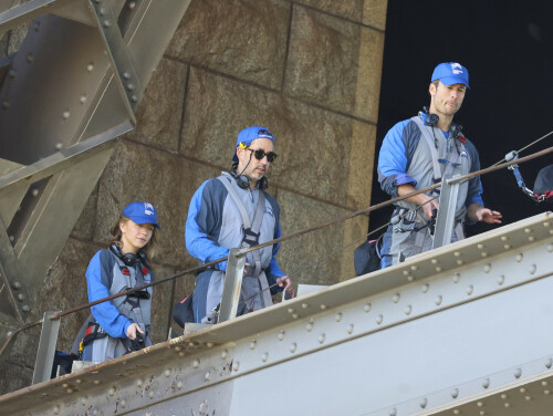 Euphoria Star Sydney Sweeney Spends Easter Holiday Climbing Sydney Harbour Bridge

Sydney Sweeney is currently shooting a new romantic comedy in Australia.

On Easter Sunday, the actress spent her day off climbing the Sydney Harbor Bridge alongside her co-star, Glen Powell, 34.

The Euphoria star shone as she took in the breathtaking view from far above the city.

The 25-year-old was decked out in a climbing suit in shades of gray and blue and a safety harness.

She completed her look with a baby cap and minimal make-up for the strenuous climb.

Sydney Sweeney is currently shooting a new romantic comedy in Australia

On Easter Sunday, the actress spent her day off climbing the Sydney Harbor Bridge alongside her co-star, Glen Powell

The Euphoria star shone as she took in the breathtaking view from far above the city

The beauty had her blonde locks around her face and a pair of headphones around her neck.

Glen opted for the same ensemble, with a classic climbing suit and matching blue cap.

Last month, the two took a break from filming to visit the Taronga Zoo together and feed giraffes.

Sydney has been Down Under for several weeks now and last week visited another popular tourist spot – Luna Park.

A guide led the actress up the many steps to the top of the bridge

She has filmed in locations around the city, including the inner-city suburb of Surry Hills and Double Bay, in the east of the city.

The yet-to-be-titled romantic comedy is directed by Will Gluck, who helmed the romantic comedies Easy A and Friends With Benefits.

Details about the plot of the R-rated movie are being kept under wraps, but the movie will also star Bryan Brown, Michelle Hurd, Hadley Robinson, and Darren Barnet.

The project is expected to bring in AUD$41 million to the local New South Wales economy and create more than 440 jobs for cast and crew.

Details about the plot of the R-rated movie are being kept under wraps, but the movie will also star Bryan Brown, Michelle Hurd, Hadley Robinson and Darren Barnet

The actress is best known for starring in The White Lotus and playing Cassie Howard on the HBO hit show Euphoria.

Sydney is engaged to Jonathan Davino, 37, a millionaire restaurant owner. The couple confirmed their engagement to People in March last year.

Sweeney and her fiancé were first spotted in each other’s company in 2018.

The actress made a rare statement about her love life during an interview with Cosmopolitan last year, saying she wasn’t romantically interested in anyone who works in the entertainment industry.

Maverick star Glen was spotted picking up his gorgeous model girlfriend Gigi Paris from the airport in Australia last month, while Gigi came to visit him on location

“I don’t date people who are in the spotlight. I don’t date actors or musicians or anyone in the entertainment business because that way I can just be normal Syd and it’s easiest. I have a great support system,” she said.

The artist did speak about the qualities she was looking for in a partner.

‘I’m looking for a best friend. I need to be able to be with someone who I can hang out with literally 24/7 and who I never tire of and who we laugh about every day,” she said.

Maverick star Glen was spotted last month picking up his gorgeous model girlfriend Gigi Paris from the airport in Australia, while Gigi came to visit him on location.