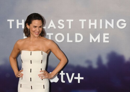 Jennifer Garner at the premiere of “The Last Thing He Told Me” held at Regency Bruin Theatre on April 13, 2023, in Los Angeles.

Her Style: Gabriela Hearst Gail Dress with Gold Bar Custom + Giuseppe Zanotti Intriigo Strap Sandals

Jennifer Garner, who stars in the movie, made a rare red carpet appearance wearing a strapless white ankle-length gown. The dress included mini gold plates up and down the front. She paired the look with gold sandals and dainty drop earrings. Garner also wore a shimmering eye look along with nude lipstick.

Jennifer Garner Shines in White Gabriela Hearst Dress & Gold Sandals at Apple TV+ ‘s ‘The Last Thing He Told Me’ Premiere

Jennifer Garner attended the Los Angeles premiere of Apple TV+ ‘s “The Last Thing He Told Me” yesterday.

The thespian was clad in a Gabriela Hearst dress in white with a strapless bodice followed by rows of rectangular gold-plated detailing. Garner’s dress stopped just above the ankles and featured a striking bodycon fit.

As for accessories, Garner wore all-gold jewelry including diamond-encrusted rings and dangling earrings.

Adding some extra bling to her look, Garner stepped out in gold sandal heels with a shiny chromatic finish, pointed toes and thick secure straps. The 3 to 4-inch heels worn at the premiere offered the “13 Going on 30” star a few extra inches, lengthening her silhouette.

When it comes to shoes, the “Adam Project” actress regularly wears athletic sneakers that are ideal for school pickups or running, from brands like Brooks, Newton, Glycerin and Nike. However, contemporary styles by high-fashion brands have also entered her rotation, like Brunello Cucinelli oxfords, Chloé sandals, and sneakers by Gucci, Prada and Isabel Marant.

Apple TV+ ‘s “The Last Thing He Told Me” is a thriller show based on a novel of the same name. The story follows Hannah, played by Jennifer Garner, as she forges a relationship with her 16-year-old stepdaughter, Bailey, to find the truth behind why her husband has mysteriously disappeared. Episode one of the highly anticipated television show premiered today.