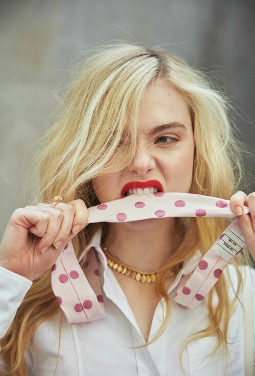 Elle Fanning Photoshoot for Flaunt Magazine 186: The Pomenade Issue, April 2023

Details: THOM BROWNE shirt, tie and CARTIER necklace and ring.

Elle Fanning Covers The New Issue Of FLAUNT Magazine

Elle Fanning is on the cover of the new issue of FLAUNT magazine. The young actress is on the cover to promote the latest season of her hit comedy series, The Great. Highlights from her interview are below.

On how her and her character, Catherine, have become intertwined: “I have been reflecting a lot on Catherine and myself and how our lives have intertwined. We did the pilot when I was 20 and now, I’m about to turn 25. I’ve been on this show during the most formative years of my life and Catherine has become imprinted on my soul. I wonder if it’s her who’s helped me, or is it me who has just put so much of myself into her? I’m not sure. The lines are starting to blur a lot with the both of us. But it is the most special part I’ve ever had.”

On the production company she started with her sister, Dakota: “I worked with this actor, I won’t say who, but he’s very established. But he said he’d never worked with a female director before,. And I was like ‘What?!’ It was so surprising to me. With our company [Lewellen Pictures] we try to have female writers and directors to tell any story—not just female-driven ones, although of course they’re a focus… but just because you’re a female director doesn’t mean that you have to tell a female-driven story.”

The new season of The Great drops on Hulu on May 12.

#ElleFanning