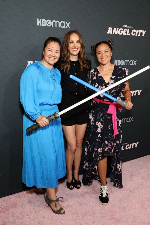 Natalie Portman - HBO Documentary Films' Series 'Angel City' Premiere in West Hollywood - May 4, 2023

Natalie attended HBO Documentary Films’ Series “Angel City” Los Angeles Premiere at Pacific Design Center in West Hollywood, California on May 4, 2023. Kara Nortman and Julie Uhrman, the co-founders of the team and the vast majority of the players also walked the red carpet with her.

Natalie Portman Walks Pink Carpet for Angel City Premiere

On Thursday, May 4, 2023, HBO hosted the red carpet premiere for the highly anticipated documentary series, ANGEL CITY, at the Pacific Design Center in Los Angeles. Executive producer and Angel City Co-Founder Natalie Portman attended, along with director Arlene Nelson, executive producers Elizabeth Chai Vasarhelyi, Christine O’Malley, Anna Barnes, Sophie Mas, and co-producer Michaela Celella.

Angel City Football Club attendees included Angel City FC Co-Founder and President Julie Uhrman, Co-Founder Kara Nortman, Angel City FC star players Christen Press, Sydney Leroux, and Simone Charley, Angel City FC manager Freya Coombe, National Women’s Soccer League Commissioner Jessica Berman, Angel City investors and former US Women’s National Team players Angela Hucles, Shannon MacMillan, and Ronnie Fair Sullins, Angel City investor and former US Men’s National Team player Cobi Jones and Los Angeles Sparks player Jordin Canada.

Angel City is a gripping docuseries that goes behind the scenes and onto the pitch of the groundbreaking Los Angeles-based professional National Women’s Soccer League team, Angel City Football Club. Pulling back the curtain on the origin story through the 2022 inaugural season of the female-founded and led team, the series reveals the passion and grit needed to build a franchise from scratch and blaze a bold trail in the world of professional sports.

Natalie Portman Is a Miu Miu Girl in Tiny Shorts & Peep-Toe Heels at ‘Angel City’ LA Premiere

Natalie Portman gave power dressing an edgy upgrade for the premiere of the “Angel City” documentary in West Hollywood, Calif., on Thursday. The Academy Award-winning actress is one of the directors of the new HBO docuseries, which takes a deep dive into the origins of the professional women’s soccer team, Angel City FC.

Portman put her own personal spin on monochromatic style for the occasion. The “Thor: Love and Thunder” star arrived at the Pacific Design Center in a full ensemble by Miu Miu.

Portman’s outfit included a black jacket and matching tiny boy shorts. Both pieces were decorated with gold buttons and had square pockets at the front.

Sticking to a minimalistic style moment, Portman opted for minimal accessories. As for glam, the entertainer went with soft makeup and styled her hair in loose waves.

Giving the outfit a literal boost, the “Black Swan” actress completed her look with a pair of peep-toe platform pumps. The silhouette featured a large bow across the toe, a thick strap at the back and sat atop a thin stiletto heel.

When it comes to fashion, Portman has a stylish yet refined aesthetic. The Golden Globe winner tends to gravitate towards creations from labels like Mugler Haute Couture, Givenchy and even Gucci for red-carpet events and appearances.

“Angel City” is a gripping docuseries that goes behind the scenes and onto the pitch of the groundbreaking Los Angeles-based professional women’s soccer team, Angel City Football Club. Pulling back the curtain on the origin story through the 2022 inaugural season of the female-founded and led team, the series reveals the passion and grit needed to build a franchise from scratch and blaze a bold trail in the world of professional sports. The three-part HBO original documentary was directed by Arlene Nelson and executive produced by Academy Award-winners Natalie Portman, Elizabeth Chai Vasarhelyi and Jimmy Chin, with Sophie Mas, Anna Barnes and Christine O’Malley.

#NataliePortman