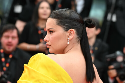 Adriana Lima Steals the Show in Yellow Bow Dress & Jimmy Choo Sandals at Cannes Film Festival

Adriana Lima graces the "Indiana Jones And The Dial Of Destiny" red carpet during the 76th annual Cannes film festival at Palais des Festivals on May 18, 2023 in Cannes, France.

Even though she’s not featured in the movie, Adriana Lima was the center of attention on the red carpet of the “Indiana Jones and the Dial of Destiny” premier at the 2023 Cannes Film Festival.

The Brazilian supermodel, who has been a fixture at the French festival for the past decade, hit the red carpet in a show-stopping black and yellow gown for the long-awaited premiere. The style, a design by Australian couturier Tamara Ralph, features a strapless heart-shaped neckline top and floor-gracing straight skirt finished with a large silk yellow bow that goes from front to back ending in a long train.

The Victoria’s Secret icon accessorized the gown with a pair of silver stud earrings and a silver bracelet by historic French jewelry house Chopard. When it came to beauty, Lima flaunted bronzed cheeks, a subtle smokey eye with earthy-toned eyeshadow and a matte nude-red lip. She styled her dark brown hair in a low bun with a dramatic side part with a glossy finish.

Regarding footwear, she opted for a pair of Jimmy Choo heels. Although it’s not too visible due to the dress’ length, the style seems to be a pair of black suede sandals with a thin strap over the toes and likely a high stiletto heel.

After decades of playing at the highest levels of the fashion game, Lima has been an ambassador for fashion and beauty iconic brands such as Puma, Victoria’s Secret, Alexander Wang and Maybelline, among others. When it comes to her own fashion style, she often goes for daring but always stylish choices, including her shoes. She’s often seen in stand-out and colorful silhouettes from top brands Christian Louboutin, Giuseppe Zanotti and Jimmy Choo.

footwearnews.com

#AdrianaLima