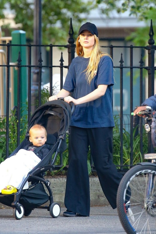 Jennifer Lawrence goes casual as she takes son Cy out for a walk after wearing flip flops at Cannes

Jennifer Lawrence goes casual as she takes son Cy out for a walk in NYC… after she made a splash by wearing flip flops with her red gown at Cannes

Jennifer Lawrence is back in mom mode after her glamorous moment at the Cannes Film Festival.

The Hunger Games star, 32, was spotted back in New York City on Saturday morning as she spent some quality time with her son Cy, one.

She cut a casual figure in a pair of loose black cotton pants and a baggy blue T-shirt as she pushed the little boy in his stroller on a walk.

The actress covered up her long blond hair with a black ball cap, and she wore classic black Adidas trainers.

Jennifer, who shares Cy with her husband Cooke Maroney, wore air pods in her ears as she pushed the stroller her adorable toddler.

Mom mode: Jennifer Lawrence is back in mom mode after her glamorous moment at the Cannes Film Festival. She took a walk in NYC with her son Cy, one, on Saturday

Her outing comes after she stunned at Cannes in a red gown with very unusual footwear.

The Silver Linings Playbook actress was at Cannes for the premiere of the film Anatomy of a Fall.

She looked gorgeous in a long red gown featuring an A-line skirt and a long train with a surprising twist — she wore black flip flops.

The unconventional pairing of a high fashion gown and simple flip flops surprised fans but it really shouldn’t have as the Don’t Look Up actress has a history of tripping and falling.

In fact, her Hunger Games costar Liam Hemsworth hilariously said: ‘She’s terrible at walking. I am constantly surprised by how much she falls down without trying at all,’ during a 2015 appearance on Late Night with Seth Meyers.

The Red Sparrow actress famously tripped and fell at the Oscars in 2013 as she was walking up the steps to accept her Academy Award for Best Actress.

The following year she tripped and fell while walking the red carpet at an event.

Two years later she tripped and lost a shoe as she left a dinner in celebration of her film Silver Linings Playbook in London.

The comfy footwear ensured the No Hard Feelings star wouldn’t face plant at the glamorous event.

Walk: She cut a casual figure in a pair of loose black cotton pants and a baggy blue T-shirt. The Hunger Games star, 32, put a black ball cap on over her long blonde hair

In the upcoming film, Jennifer plays Maddie, a bartender and wanna be Uber delivery driver ‘desperate for cash’ who ‘accepts a Craigslist ad from a couple seeking someone to date their painfully awkward teenage son,’ according to the IMDB synopsis.

Maddie helps the teen Percy (Andrew Barth Feldman) unleash his wild side, introducing him to alcohol, partying, making crude jokes and quipping about sex dolls.

The film marks a return to comedy for the Oscar winner, who has been playing more dramatic roles lately.

No Hard Feelings hits theaters on June 23.

uk-times.com

#JenniferLawrence