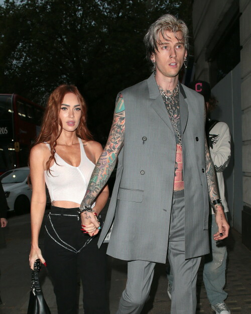 Megan Fox and Machine Gun Kelly Attend an Event in London Together amid Rekindling Their Romance

The couple were spotted together after a source recently told PEOPLE that they are working on "making their relationship better"

Megan Fox and Machine Gun Kelly just touched down in London town.

The couple was spotted attending an event in London together on Tuesday night after a source recently told PEOPLE that they are working on "making their relationship better."

With her new ginger hair on display, the 37-year-old actress sported a white see-through asymmetrical tank and studded black pants with a matching handbag and platform heels.
The 33-year-old musician showed off his tatted arms in a sleeveless oversized gray suit. He completed the look with a long dangling chain necklace and black-and-white sneakers.

Megan Fox and MGK 'Still Not Back to Normal' as They Try for 'Better' Relationship: Source (Exclusive)
Last week, a source told PEOPLE of the couple, "They are back together. They have explored therapy. Things are still not back to normal though."

The couple have been engaged since January 2022.

The source added that Fox and MGK "were wedding planning, but not anymore. They don't have a wedding date. Megan still seems hesitant."

"She has just put so much time into their relationship. It's hard for her to let go," said the source.

Megan Fox, Machine Gun Kelly 'Slowly' Reconciling — But Wedding Planning Is 'Halted': Source (Exclusive)
The Jennifer's Body actress hinted at a possible breakup this past February, removing photos of her musician fiancé from her Instagram account and posting a cryptic caption. A week later, she returned to Instagram to break her silence amid speculation that their relationship might be over.

Fox wrote at the time, "There has been no third party interference in this relationship of any kind. That includes, but is not limited to...actual humans, DMs, AI bots or succubus demons."

In April, the two were photographed holding hands on a trip to Hawaii. And earlier this month, MGK showed up to the Sports Illustrated Swimsuit issue launch to support Fox, who is a cover star this year. However, the pair did not walk the red carpet together.

After that public sighting, a separate insider told PEOPLE their wedding planning "remains halted" even as they gradually repair their relationship.

"He's doing whatever he can to get her back, and she's making him work for it. It's still an unhealthy dynamic though, and their friends just don't see this lasting," the insider said. "He has a lot of proving himself to do, and he doesn't want to give her up. He is great with her kids and super hands-on. It's a work in progress."

people.com

#MeganFox