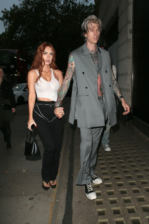 Megan Fox and Machine Gun Kelly Attend an Event in London Together amid Rekindling Their Romance

The couple were spotted together after a source recently told PEOPLE that they are working on "making their relationship better"

Megan Fox and Machine Gun Kelly just touched down in London town.

The couple was spotted attending an event in London together on Tuesday night after a source recently told PEOPLE that they are working on "making their relationship better."

With her new ginger hair on display, the 37-year-old actress sported a white see-through asymmetrical tank and studded black pants with a matching handbag and platform heels.
The 33-year-old musician showed off his tatted arms in a sleeveless oversized gray suit. He completed the look with a long dangling chain necklace and black-and-white sneakers.

Megan Fox and MGK 'Still Not Back to Normal' as They Try for 'Better' Relationship: Source (Exclusive)
Last week, a source told PEOPLE of the couple, "They are back together. They have explored therapy. Things are still not back to normal though."

The couple have been engaged since January 2022.

The source added that Fox and MGK "were wedding planning, but not anymore. They don't have a wedding date. Megan still seems hesitant."

"She has just put so much time into their relationship. It's hard for her to let go," said the source.

Megan Fox, Machine Gun Kelly 'Slowly' Reconciling — But Wedding Planning Is 'Halted': Source (Exclusive)
The Jennifer's Body actress hinted at a possible breakup this past February, removing photos of her musician fiancé from her Instagram account and posting a cryptic caption. A week later, she returned to Instagram to break her silence amid speculation that their relationship might be over.

Fox wrote at the time, "There has been no third party interference in this relationship of any kind. That includes, but is not limited to...actual humans, DMs, AI bots or succubus demons."

In April, the two were photographed holding hands on a trip to Hawaii. And earlier this month, MGK showed up to the Sports Illustrated Swimsuit issue launch to support Fox, who is a cover star this year. However, the pair did not walk the red carpet together.

After that public sighting, a separate insider told PEOPLE their wedding planning "remains halted" even as they gradually repair their relationship.

"He's doing whatever he can to get her back, and she's making him work for it. It's still an unhealthy dynamic though, and their friends just don't see this lasting," the insider said. "He has a lot of proving himself to do, and he doesn't want to give her up. He is great with her kids and super hands-on. It's a work in progress."

people.com

#MeganFox