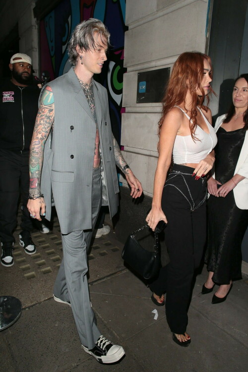 Megan Fox and Machine Gun Kelly Attend an Event in London Together amid Rekindling Their Romance

The couple were spotted together after a source recently told PEOPLE that they are working on "making their relationship better"

Megan Fox and Machine Gun Kelly just touched down in London town.

The couple was spotted attending an event in London together on Tuesday night after a source recently told PEOPLE that they are working on "making their relationship better."

With her new ginger hair on display, the 37-year-old actress sported a white see-through asymmetrical tank and studded black pants with a matching handbag and platform heels.
The 33-year-old musician showed off his tatted arms in a sleeveless oversized gray suit. He completed the look with a long dangling chain necklace and black-and-white sneakers.

Megan Fox and MGK 'Still Not Back to Normal' as They Try for 'Better' Relationship: Source (Exclusive)
Last week, a source told PEOPLE of the couple, "They are back together. They have explored therapy. Things are still not back to normal though."

The couple have been engaged since January 2022.

The source added that Fox and MGK "were wedding planning, but not anymore. They don't have a wedding date. Megan still seems hesitant."

"She has just put so much time into their relationship. It's hard for her to let go," said the source.

Megan Fox, Machine Gun Kelly 'Slowly' Reconciling — But Wedding Planning Is 'Halted': Source (Exclusive)
The Jennifer's Body actress hinted at a possible breakup this past February, removing photos of her musician fiancé from her Instagram account and posting a cryptic caption. A week later, she returned to Instagram to break her silence amid speculation that their relationship might be over.

Fox wrote at the time, "There has been no third party interference in this relationship of any kind. That includes, but is not limited to...actual humans, DMs, AI bots or succubus demons."

In April, the two were photographed holding hands on a trip to Hawaii. And earlier this month, MGK showed up to the Sports Illustrated Swimsuit issue launch to support Fox, who is a cover star this year. However, the pair did not walk the red carpet together.

After that public sighting, a separate insider told PEOPLE their wedding planning "remains halted" even as they gradually repair their relationship.

"He's doing whatever he can to get her back, and she's making him work for it. It's still an unhealthy dynamic though, and their friends just don't see this lasting," the insider said. "He has a lot of proving himself to do, and he doesn't want to give her up. He is great with her kids and super hands-on. It's a work in progress."

people.com

#MeganFox