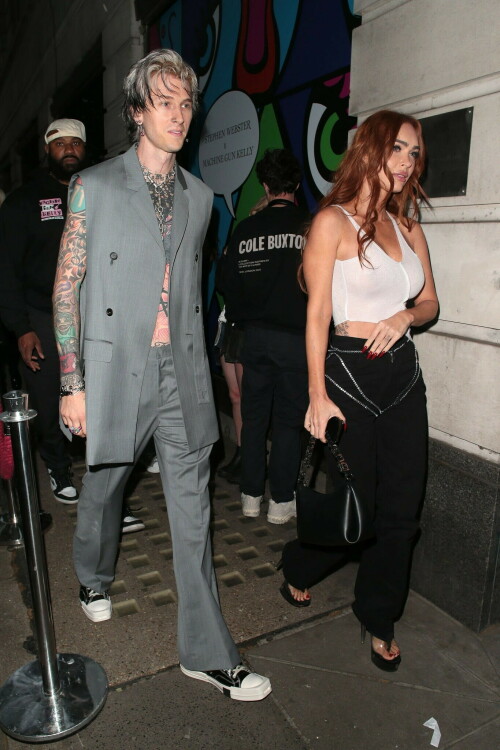 Megan Fox and Machine Gun Kelly Attend an Event in London Together amid Rekindling Their Romance

The couple were spotted together after a source recently told PEOPLE that they are working on "making their relationship better"

Megan Fox and Machine Gun Kelly just touched down in London town.

The couple was spotted attending an event in London together on Tuesday night after a source recently told PEOPLE that they are working on "making their relationship better."

With her new ginger hair on display, the 37-year-old actress sported a white see-through asymmetrical tank and studded black pants with a matching handbag and platform heels.
The 33-year-old musician showed off his tatted arms in a sleeveless oversized gray suit. He completed the look with a long dangling chain necklace and black-and-white sneakers.

Megan Fox and MGK 'Still Not Back to Normal' as They Try for 'Better' Relationship: Source (Exclusive)
Last week, a source told PEOPLE of the couple, "They are back together. They have explored therapy. Things are still not back to normal though."

The couple have been engaged since January 2022.

The source added that Fox and MGK "were wedding planning, but not anymore. They don't have a wedding date. Megan still seems hesitant."

"She has just put so much time into their relationship. It's hard for her to let go," said the source.

Megan Fox, Machine Gun Kelly 'Slowly' Reconciling — But Wedding Planning Is 'Halted': Source (Exclusive)
The Jennifer's Body actress hinted at a possible breakup this past February, removing photos of her musician fiancé from her Instagram account and posting a cryptic caption. A week later, she returned to Instagram to break her silence amid speculation that their relationship might be over.

Fox wrote at the time, "There has been no third party interference in this relationship of any kind. That includes, but is not limited to...actual humans, DMs, AI bots or succubus demons."

In April, the two were photographed holding hands on a trip to Hawaii. And earlier this month, MGK showed up to the Sports Illustrated Swimsuit issue launch to support Fox, who is a cover star this year. However, the pair did not walk the red carpet together.

After that public sighting, a separate insider told PEOPLE their wedding planning "remains halted" even as they gradually repair their relationship.

"He's doing whatever he can to get her back, and she's making him work for it. It's still an unhealthy dynamic though, and their friends just don't see this lasting," the insider said. "He has a lot of proving himself to do, and he doesn't want to give her up. He is great with her kids and super hands-on. It's a work in progress."

people.com

#MeganFox