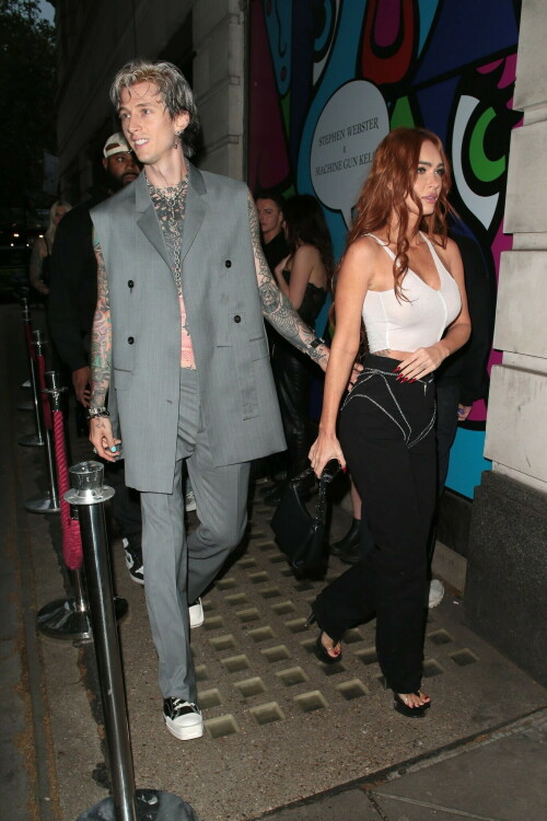 Megan Fox and Machine Gun Kelly Attend an Event in London Together amid Rekindling Their Romance

The couple were spotted together after a source recently told PEOPLE that they are working on "making their relationship better"

Megan Fox and Machine Gun Kelly just touched down in London town.

The couple was spotted attending an event in London together on Tuesday night after a source recently told PEOPLE that they are working on "making their relationship better."

With her new ginger hair on display, the 37-year-old actress sported a white see-through asymmetrical tank and studded black pants with a matching handbag and platform heels.
The 33-year-old musician showed off his tatted arms in a sleeveless oversized gray suit. He completed the look with a long dangling chain necklace and black-and-white sneakers.

Megan Fox and MGK 'Still Not Back to Normal' as They Try for 'Better' Relationship: Source (Exclusive)
Last week, a source told PEOPLE of the couple, "They are back together. They have explored therapy. Things are still not back to normal though."

The couple have been engaged since January 2022.

The source added that Fox and MGK "were wedding planning, but not anymore. They don't have a wedding date. Megan still seems hesitant."

"She has just put so much time into their relationship. It's hard for her to let go," said the source.

Megan Fox, Machine Gun Kelly 'Slowly' Reconciling — But Wedding Planning Is 'Halted': Source (Exclusive)
The Jennifer's Body actress hinted at a possible breakup this past February, removing photos of her musician fiancé from her Instagram account and posting a cryptic caption. A week later, she returned to Instagram to break her silence amid speculation that their relationship might be over.

Fox wrote at the time, "There has been no third party interference in this relationship of any kind. That includes, but is not limited to...actual humans, DMs, AI bots or succubus demons."

In April, the two were photographed holding hands on a trip to Hawaii. And earlier this month, MGK showed up to the Sports Illustrated Swimsuit issue launch to support Fox, who is a cover star this year. However, the pair did not walk the red carpet together.

After that public sighting, a separate insider told PEOPLE their wedding planning "remains halted" even as they gradually repair their relationship.

"He's doing whatever he can to get her back, and she's making him work for it. It's still an unhealthy dynamic though, and their friends just don't see this lasting," the insider said. "He has a lot of proving himself to do, and he doesn't want to give her up. He is great with her kids and super hands-on. It's a work in progress."

people.com

#MeganFox