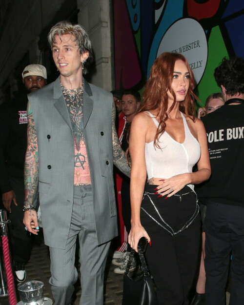 Megan Fox and Machine Gun Kelly Attend an Event in London Together amid Rekindling Their Romance

The couple were spotted together after a source recently told PEOPLE that they are working on "making their relationship better"

Megan Fox and Machine Gun Kelly just touched down in London town.

The couple was spotted attending an event in London together on Tuesday night after a source recently told PEOPLE that they are working on "making their relationship better."

With her new ginger hair on display, the 37-year-old actress sported a white see-through asymmetrical tank and studded black pants with a matching handbag and platform heels.
The 33-year-old musician showed off his tatted arms in a sleeveless oversized gray suit. He completed the look with a long dangling chain necklace and black-and-white sneakers.

Megan Fox and MGK 'Still Not Back to Normal' as They Try for 'Better' Relationship: Source (Exclusive)
Last week, a source told PEOPLE of the couple, "They are back together. They have explored therapy. Things are still not back to normal though."

The couple have been engaged since January 2022.

The source added that Fox and MGK "were wedding planning, but not anymore. They don't have a wedding date. Megan still seems hesitant."

"She has just put so much time into their relationship. It's hard for her to let go," said the source.

Megan Fox, Machine Gun Kelly 'Slowly' Reconciling — But Wedding Planning Is 'Halted': Source (Exclusive)
The Jennifer's Body actress hinted at a possible breakup this past February, removing photos of her musician fiancé from her Instagram account and posting a cryptic caption. A week later, she returned to Instagram to break her silence amid speculation that their relationship might be over.

Fox wrote at the time, "There has been no third party interference in this relationship of any kind. That includes, but is not limited to...actual humans, DMs, AI bots or succubus demons."

In April, the two were photographed holding hands on a trip to Hawaii. And earlier this month, MGK showed up to the Sports Illustrated Swimsuit issue launch to support Fox, who is a cover star this year. However, the pair did not walk the red carpet together.

After that public sighting, a separate insider told PEOPLE their wedding planning "remains halted" even as they gradually repair their relationship.

"He's doing whatever he can to get her back, and she's making him work for it. It's still an unhealthy dynamic though, and their friends just don't see this lasting," the insider said. "He has a lot of proving himself to do, and he doesn't want to give her up. He is great with her kids and super hands-on. It's a work in progress."

people.com

#MeganFox