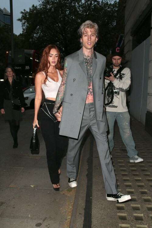 Megan Fox and Machine Gun Kelly Attend an Event in London Together amid Rekindling Their Romance

The couple were spotted together after a source recently told PEOPLE that they are working on "making their relationship better"

Megan Fox and Machine Gun Kelly just touched down in London town.

The couple was spotted attending an event in London together on Tuesday night after a source recently told PEOPLE that they are working on "making their relationship better."

With her new ginger hair on display, the 37-year-old actress sported a white see-through asymmetrical tank and studded black pants with a matching handbag and platform heels.
The 33-year-old musician showed off his tatted arms in a sleeveless oversized gray suit. He completed the look with a long dangling chain necklace and black-and-white sneakers.

Megan Fox and MGK 'Still Not Back to Normal' as They Try for 'Better' Relationship: Source (Exclusive)
Last week, a source told PEOPLE of the couple, "They are back together. They have explored therapy. Things are still not back to normal though."

The couple have been engaged since January 2022.

The source added that Fox and MGK "were wedding planning, but not anymore. They don't have a wedding date. Megan still seems hesitant."

"She has just put so much time into their relationship. It's hard for her to let go," said the source.

Megan Fox, Machine Gun Kelly 'Slowly' Reconciling — But Wedding Planning Is 'Halted': Source (Exclusive)
The Jennifer's Body actress hinted at a possible breakup this past February, removing photos of her musician fiancé from her Instagram account and posting a cryptic caption. A week later, she returned to Instagram to break her silence amid speculation that their relationship might be over.

Fox wrote at the time, "There has been no third party interference in this relationship of any kind. That includes, but is not limited to...actual humans, DMs, AI bots or succubus demons."

In April, the two were photographed holding hands on a trip to Hawaii. And earlier this month, MGK showed up to the Sports Illustrated Swimsuit issue launch to support Fox, who is a cover star this year. However, the pair did not walk the red carpet together.

After that public sighting, a separate insider told PEOPLE their wedding planning "remains halted" even as they gradually repair their relationship.

"He's doing whatever he can to get her back, and she's making him work for it. It's still an unhealthy dynamic though, and their friends just don't see this lasting," the insider said. "He has a lot of proving himself to do, and he doesn't want to give her up. He is great with her kids and super hands-on. It's a work in progress."

people.com

#MeganFox