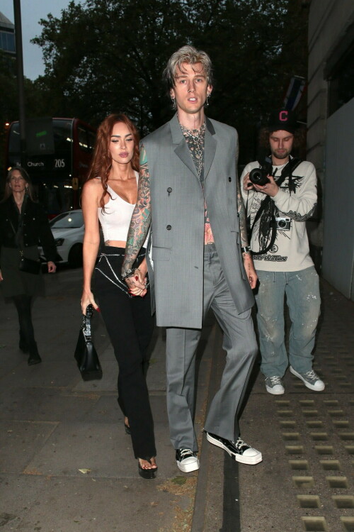 Megan Fox and Machine Gun Kelly Attend an Event in London Together amid Rekindling Their Romance

The couple were spotted together after a source recently told PEOPLE that they are working on "making their relationship better"

Megan Fox and Machine Gun Kelly just touched down in London town.

The couple was spotted attending an event in London together on Tuesday night after a source recently told PEOPLE that they are working on "making their relationship better."

With her new ginger hair on display, the 37-year-old actress sported a white see-through asymmetrical tank and studded black pants with a matching handbag and platform heels.
The 33-year-old musician showed off his tatted arms in a sleeveless oversized gray suit. He completed the look with a long dangling chain necklace and black-and-white sneakers.

Megan Fox and MGK 'Still Not Back to Normal' as They Try for 'Better' Relationship: Source (Exclusive)
Last week, a source told PEOPLE of the couple, "They are back together. They have explored therapy. Things are still not back to normal though."

The couple have been engaged since January 2022.

The source added that Fox and MGK "were wedding planning, but not anymore. They don't have a wedding date. Megan still seems hesitant."

"She has just put so much time into their relationship. It's hard for her to let go," said the source.

Megan Fox, Machine Gun Kelly 'Slowly' Reconciling — But Wedding Planning Is 'Halted': Source (Exclusive)
The Jennifer's Body actress hinted at a possible breakup this past February, removing photos of her musician fiancé from her Instagram account and posting a cryptic caption. A week later, she returned to Instagram to break her silence amid speculation that their relationship might be over.

Fox wrote at the time, "There has been no third party interference in this relationship of any kind. That includes, but is not limited to...actual humans, DMs, AI bots or succubus demons."

In April, the two were photographed holding hands on a trip to Hawaii. And earlier this month, MGK showed up to the Sports Illustrated Swimsuit issue launch to support Fox, who is a cover star this year. However, the pair did not walk the red carpet together.

After that public sighting, a separate insider told PEOPLE their wedding planning "remains halted" even as they gradually repair their relationship.

"He's doing whatever he can to get her back, and she's making him work for it. It's still an unhealthy dynamic though, and their friends just don't see this lasting," the insider said. "He has a lot of proving himself to do, and he doesn't want to give her up. He is great with her kids and super hands-on. It's a work in progress."

people.com

#MeganFox