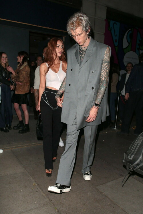 Megan Fox and Machine Gun Kelly Attend an Event in London Together amid Rekindling Their Romance

The couple were spotted together after a source recently told PEOPLE that they are working on "making their relationship better"

Megan Fox and Machine Gun Kelly just touched down in London town.

The couple was spotted attending an event in London together on Tuesday night after a source recently told PEOPLE that they are working on "making their relationship better."

With her new ginger hair on display, the 37-year-old actress sported a white see-through asymmetrical tank and studded black pants with a matching handbag and platform heels.
The 33-year-old musician showed off his tatted arms in a sleeveless oversized gray suit. He completed the look with a long dangling chain necklace and black-and-white sneakers.

Megan Fox and MGK 'Still Not Back to Normal' as They Try for 'Better' Relationship: Source (Exclusive)
Last week, a source told PEOPLE of the couple, "They are back together. They have explored therapy. Things are still not back to normal though."

The couple have been engaged since January 2022.

The source added that Fox and MGK "were wedding planning, but not anymore. They don't have a wedding date. Megan still seems hesitant."

"She has just put so much time into their relationship. It's hard for her to let go," said the source.

Megan Fox, Machine Gun Kelly 'Slowly' Reconciling — But Wedding Planning Is 'Halted': Source (Exclusive)
The Jennifer's Body actress hinted at a possible breakup this past February, removing photos of her musician fiancé from her Instagram account and posting a cryptic caption. A week later, she returned to Instagram to break her silence amid speculation that their relationship might be over.

Fox wrote at the time, "There has been no third party interference in this relationship of any kind. That includes, but is not limited to...actual humans, DMs, AI bots or succubus demons."

In April, the two were photographed holding hands on a trip to Hawaii. And earlier this month, MGK showed up to the Sports Illustrated Swimsuit issue launch to support Fox, who is a cover star this year. However, the pair did not walk the red carpet together.

After that public sighting, a separate insider told PEOPLE their wedding planning "remains halted" even as they gradually repair their relationship.

"He's doing whatever he can to get her back, and she's making him work for it. It's still an unhealthy dynamic though, and their friends just don't see this lasting," the insider said. "He has a lot of proving himself to do, and he doesn't want to give her up. He is great with her kids and super hands-on. It's a work in progress."

people.com

#MeganFox