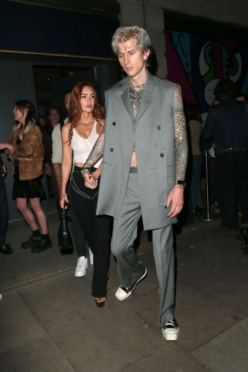 Megan Fox and Machine Gun Kelly Attend an Event in London Together amid Rekindling Their Romance

The couple were spotted together after a source recently told PEOPLE that they are working on "making their relationship better"

Megan Fox and Machine Gun Kelly just touched down in London town.

The couple was spotted attending an event in London together on Tuesday night after a source recently told PEOPLE that they are working on "making their relationship better."

With her new ginger hair on display, the 37-year-old actress sported a white see-through asymmetrical tank and studded black pants with a matching handbag and platform heels.
The 33-year-old musician showed off his tatted arms in a sleeveless oversized gray suit. He completed the look with a long dangling chain necklace and black-and-white sneakers.

Megan Fox and MGK 'Still Not Back to Normal' as They Try for 'Better' Relationship: Source (Exclusive)
Last week, a source told PEOPLE of the couple, "They are back together. They have explored therapy. Things are still not back to normal though."

The couple have been engaged since January 2022.

The source added that Fox and MGK "were wedding planning, but not anymore. They don't have a wedding date. Megan still seems hesitant."

"She has just put so much time into their relationship. It's hard for her to let go," said the source.

Megan Fox, Machine Gun Kelly 'Slowly' Reconciling — But Wedding Planning Is 'Halted': Source (Exclusive)
The Jennifer's Body actress hinted at a possible breakup this past February, removing photos of her musician fiancé from her Instagram account and posting a cryptic caption. A week later, she returned to Instagram to break her silence amid speculation that their relationship might be over.

Fox wrote at the time, "There has been no third party interference in this relationship of any kind. That includes, but is not limited to...actual humans, DMs, AI bots or succubus demons."

In April, the two were photographed holding hands on a trip to Hawaii. And earlier this month, MGK showed up to the Sports Illustrated Swimsuit issue launch to support Fox, who is a cover star this year. However, the pair did not walk the red carpet together.

After that public sighting, a separate insider told PEOPLE their wedding planning "remains halted" even as they gradually repair their relationship.

"He's doing whatever he can to get her back, and she's making him work for it. It's still an unhealthy dynamic though, and their friends just don't see this lasting," the insider said. "He has a lot of proving himself to do, and he doesn't want to give her up. He is great with her kids and super hands-on. It's a work in progress."

people.com

#MeganFox