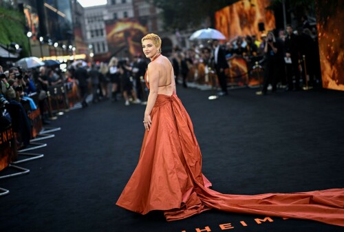 Florence Pugh | 'Oppenheimer' premiere, London, UK - July 13, 2023

'Oppenheimer' Cast Squeezes in London Premiere Red Carpet as Potential Actors Strike Looms

SAG-AFTRA is expected to announce their decision whether to go on strike Thursday afternoon

The cast of Oppenheimer hit the red carpet in London earlier than expected on Thursday, amid a potentially imminent actors' strike.

Cillian Murphy, Florence Pugh, Matt Damon, Emily Blunt, Robert Downey Jr. and more attended the U.K. premiere of Christopher Nolan's upcoming biopic at Odeon Luxe Leicester Square, hours before SAG-AFTRA makes a decision about whether to strike against the Alliance of Motion Picture and Television Producers (AMPTP).

Downey, 58, wore a gray suit, while Blunt, 40, Murphy, 47, and Damon, 52, opted for mostly black attire, with Blunt's dress featuring dramatic cutouts and a silvery pattern. The actress also accessorized in Lorraine Schwartz jewelry featuring Colombian emeralds and diamonds.

Pugh, 27, rocked a copper-orange gown — which matched the color scheme of the premiere’s backdrop featuring reddish smoke from an explosion — with a plunging ruched neckline and wide cutouts on the sides. Her shaved-head look also appeared to have grown out into a short blonde 'do.

Of the potential strike, Blunt told Deadline on the red carpet, "I hope everyone makes a fair deal and we are here to celebrate this movie. And if they call it, we’ll be leaving together as cast in unity with everyone … We will see what happens. Right now it’s the joy to be together."

Variety reported that the start time of the red carpet was pushed up an hour in the hopes of pulling off the event before any strike were to begin.

The film follows J. Robert Oppenheimer (played by Murphy), the scientist who famously led the Manhattan Project — the effort to create an atomic bomb during World War II.

Following the recent (and ongoing) Writers Guild of America (WGA) strike, which caused many TV and movie writers to leave the writers’ room and head to the picket lines, the Screen Actors Guild is pushing for a new contract with the AMPTP.

If they don’t reach a new agreement that meets their terms, many actors have already threatened to strike, which could delay countless movie and TV projects. This could be dire for the film industry as many projects have already paused production amid the writers’ strike.

SAG-AFTRA’s current contract with the studios was set to expire June 30, but was later extended until July 7, Deadline previously reported.

However, after a recent negotiation held on Wednesday failed to produce a new agreement, CNN reported, a SAG strike appears to be imminent.

SAG-AFTRA's president Fran Drescher and national executive director & chief negotiator Duncan Crabtree-Ireland said in an official letter addressed to members on Thursday morning that the group "called for a meeting with our National Board this morning to vote on a strike order."

Defining the AMPTP as "the entity that represents major studios and streamers, including Amazon, Apple, Disney, NBCUniversal, Netflix, Paramount, Sony, and Warner Bros Discovery," Drescher, 65, and Crabtree-Ireland alleged the group "remains unwilling to offer a fair deal on the key issues that you told us are important to you."

"Though we’ve engaged in negotiations in good faith and remained eager to reach a deal that sufficiently addressed performer concerns, the AMPTP’s responses to our proposals have not been adequate," they wrote in the letter.

Crabtree-Ireland and the Nanny alum promised to update members "immediately after the National Board’s vote," adding that "information will be provided on how the strike impacts your ability to work. Details on picket times and locations will be provided as well."

"Our 90-year history is a testament to what can be achieved through our conviction and unity. For the future of our profession, we stand together," they concluded.

On Tuesday, the union announced it had agreed to what it described as "the AMPTP’s last-minute request for federal mediation" with just hours to go before the deadline, though it alleged that the AMPTP had leaked its request for mediation to the press before it informed the union's leadership of that request.

"We will not be manipulated by this cynical ploy to engineer an extension when the companies have had more than enough time to make a fair deal," SAG said in a statement Tuesday.

SAG-AFTRA members previously voted 97.91% in favor of authorizing a strike on June 5 before it began negotiations with the AMPTP on June 7, though that vote did not immediately call for a strike.

“Together we lock elbows and in unity we build a new contract that honors our contributions in this remarkable industry, reflects the new digital and streaming business model and brings ALL our concerns for protections and benefits into the now!" Drescher said in a statement at the time.

People

#FlorencePugh