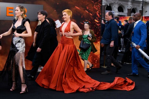 Florence Pugh | 'Oppenheimer' premiere, London, UK - July 13, 2023

'Oppenheimer' Cast Squeezes in London Premiere Red Carpet as Potential Actors Strike Looms

SAG-AFTRA is expected to announce their decision whether to go on strike Thursday afternoon

The cast of Oppenheimer hit the red carpet in London earlier than expected on Thursday, amid a potentially imminent actors' strike.

Cillian Murphy, Florence Pugh, Matt Damon, Emily Blunt, Robert Downey Jr. and more attended the U.K. premiere of Christopher Nolan's upcoming biopic at Odeon Luxe Leicester Square, hours before SAG-AFTRA makes a decision about whether to strike against the Alliance of Motion Picture and Television Producers (AMPTP).

Downey, 58, wore a gray suit, while Blunt, 40, Murphy, 47, and Damon, 52, opted for mostly black attire, with Blunt's dress featuring dramatic cutouts and a silvery pattern. The actress also accessorized in Lorraine Schwartz jewelry featuring Colombian emeralds and diamonds.

Pugh, 27, rocked a copper-orange gown — which matched the color scheme of the premiere’s backdrop featuring reddish smoke from an explosion — with a plunging ruched neckline and wide cutouts on the sides. Her shaved-head look also appeared to have grown out into a short blonde 'do.

Of the potential strike, Blunt told Deadline on the red carpet, "I hope everyone makes a fair deal and we are here to celebrate this movie. And if they call it, we’ll be leaving together as cast in unity with everyone … We will see what happens. Right now it’s the joy to be together."

Variety reported that the start time of the red carpet was pushed up an hour in the hopes of pulling off the event before any strike were to begin.

The film follows J. Robert Oppenheimer (played by Murphy), the scientist who famously led the Manhattan Project — the effort to create an atomic bomb during World War II.

Following the recent (and ongoing) Writers Guild of America (WGA) strike, which caused many TV and movie writers to leave the writers’ room and head to the picket lines, the Screen Actors Guild is pushing for a new contract with the AMPTP.

If they don’t reach a new agreement that meets their terms, many actors have already threatened to strike, which could delay countless movie and TV projects. This could be dire for the film industry as many projects have already paused production amid the writers’ strike.

SAG-AFTRA’s current contract with the studios was set to expire June 30, but was later extended until July 7, Deadline previously reported.

However, after a recent negotiation held on Wednesday failed to produce a new agreement, CNN reported, a SAG strike appears to be imminent.

SAG-AFTRA's president Fran Drescher and national executive director & chief negotiator Duncan Crabtree-Ireland said in an official letter addressed to members on Thursday morning that the group "called for a meeting with our National Board this morning to vote on a strike order."

Defining the AMPTP as "the entity that represents major studios and streamers, including Amazon, Apple, Disney, NBCUniversal, Netflix, Paramount, Sony, and Warner Bros Discovery," Drescher, 65, and Crabtree-Ireland alleged the group "remains unwilling to offer a fair deal on the key issues that you told us are important to you."

"Though we’ve engaged in negotiations in good faith and remained eager to reach a deal that sufficiently addressed performer concerns, the AMPTP’s responses to our proposals have not been adequate," they wrote in the letter.

Crabtree-Ireland and the Nanny alum promised to update members "immediately after the National Board’s vote," adding that "information will be provided on how the strike impacts your ability to work. Details on picket times and locations will be provided as well."

"Our 90-year history is a testament to what can be achieved through our conviction and unity. For the future of our profession, we stand together," they concluded.

On Tuesday, the union announced it had agreed to what it described as "the AMPTP’s last-minute request for federal mediation" with just hours to go before the deadline, though it alleged that the AMPTP had leaked its request for mediation to the press before it informed the union's leadership of that request.

"We will not be manipulated by this cynical ploy to engineer an extension when the companies have had more than enough time to make a fair deal," SAG said in a statement Tuesday.

SAG-AFTRA members previously voted 97.91% in favor of authorizing a strike on June 5 before it began negotiations with the AMPTP on June 7, though that vote did not immediately call for a strike.

“Together we lock elbows and in unity we build a new contract that honors our contributions in this remarkable industry, reflects the new digital and streaming business model and brings ALL our concerns for protections and benefits into the now!" Drescher said in a statement at the time.

People

#FlorencePugh