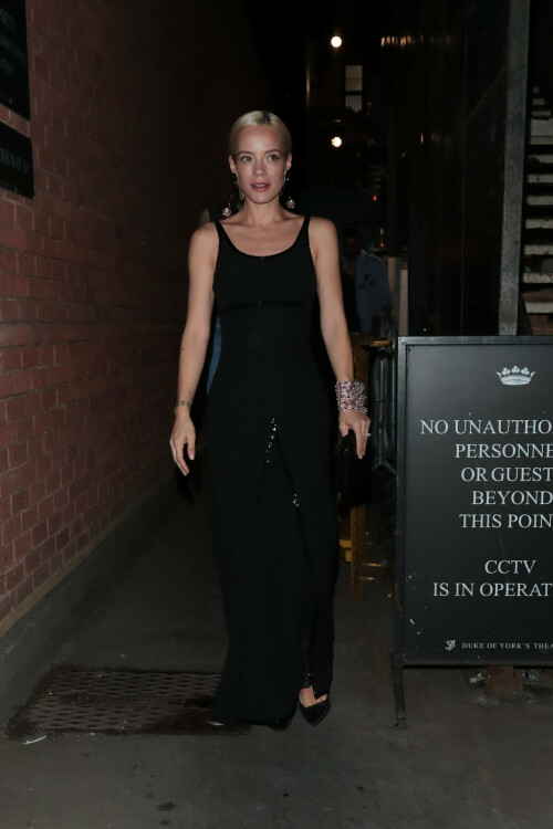 Lily Allen seen leaving the Duke of York's Theatre after her performance in 'The Pillowman' on August 21, 2023 in London, England.

Lily Allen puts on a stylish display in a Giorgio Armani gown as she leaves the theatre after The Pillowman

She's been turning the stage door path into her own personal runway night after night.

And Lily Allen pulled off another sartorial win on Monday as she left the Duke of York's Theatre in a chic a Giorgio Armani gown after her performance in The Pillowman.

The singer, 38, looked incredible in a sweeping black dress that cinched in at her slender waist and skimmed out into a full skirt.

Featuring sequinned embellishment that caught the eye, the garment ensured all eyes would be on her as she left the theatre.

Adding to the glamour she donned a stack of chunky pink bangles on one arm and slicked her peroxide blonde locks back to expose statement earrings.

The star recently revealed why she changes into glamorous outfits every night to leave the theatre after her performances in The Pillowman.

Lily has been starring in Martin McDonagh's revival of the show at London's Duke Of York Theatre and is often seen strutting home in a series of stylish looks.

In a Q&A one fan asked her: 'Is it a "thing" to get dressed up after your show?! Do you go home & just get changed again?!'

She replied saying that sometimes it helps her transition back after playing the 'harrowing role' but that other times it's just because she feels like 'that b****h'.

Lily penned: 'The role that I'm doing is pretty harrowing. It's nice to come off stage and transition into something glamorous. It really helps me to separate what's happened on stage.

'Plus I'm very lucky and people send me wonderful things to wear. People at the stage door get a nicer picture. And also sometimes I'm just THAT B***CH.'

Lily has been consistently serving her admirers and audience designer, high-fashion looks after finishing up her strenuous performances.

The mother-of-two recently spoken about the challenges she has faced in her demanding role that has kept her away from her loved ones during its ongoing three-month run.

Taking to Instagram, Lily admitted she was battling loneliness as a result, exacerbated by her children's attendance at a summer camp in the United States.

She wrote: 'Hello Monday. 1 month to go of The Pillowman.

'Missing home, missing my bubbas who are both at summer camp, haven't even spoken to them for 2 weeks!

'Tired and lonely but the Banya always manages to get my blood going and lift my spirits.'

#LilyAllen