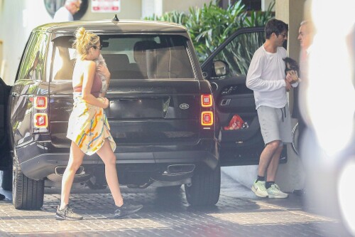 Ashley Benson and Brandon Davis step out for lunch with their puppies in Los Angeles - August 23, 2023

Who Is Ashley Benson's Fiancé? All About Brandon Davis

Ashley Benson and Brandon Davis were first linked in January 2023. They announced their engagement in July 2023

Ashley Benson and Brandon Davis are getting married!

In July 2023, Davis announced their engagement on his Instagram Story, posting a picture of Benson's massive diamond ring. Over the photo, he called Benson "Love of my life."

Benson then reshared the post, captioning it with, “My best frienddddd, I love you.”

The Pretty Little Liars actress and the oil heir first sparked romance rumors in January 2023 after they were spotted sitting courtside at a basketball game. PEOPLE confirmed their relationship in February.

"They have a lot of mutual friends and are both super fun and very social people," said a source close to the couple.

Davis, who is the grandson of billionaire oil tycoon Marvin Davis, has been making headlines long before meeting Benson. In the mid-2000s, he frequently partied with Paris Hilton and briefly dated actress Mischa Barton.

So, who is Ashley Benson's fiancé? Here's everything to know about Brandon Davis.

He is an heir to an oil fortune

The grandson of a billionaire oil tycoon, Davis is an heir to a massive fortune. His grandfather, Marvin Davis, built his wealth through lucrative business deals in both the oil and entertainment industries.

According to his 2004 New York Times obituary, the elder Davis sold his oil holdings in the early 1980s and began investing in entertainment and real estate, acquiring companies such as 20th Century Fox, Pebble Beach Company, the Aspen Skiing Company and the Beverly Hills Hotel.

He has four siblings

Davis has two brothers, Alexander and Jason, and two half-sisters, Mariella and Isabella Rickel, from his mother's second marriage.

Jason Davis, an actor best known for voicing Mikey Blumberg on the ABC animated series Recess, died from a Fentanyl overdose in February 2020 at age 35.

He dated Mischa Barton

Benson isn't Davis' first Hollywood girlfriend. In 2004, he began dating The O.C. actress Mischa Barton after they were introduced at a charity event. Their relationship lasted slightly over a year, and their breakup was confirmed in July 2005.

"They are no longer together but they remain close friends," Barton's publicist, Craig Schneider, told PEOPLE at the time.

Davis confirmed the news via his publicist Ken Sunshine, telling PEOPLE, "I wish her only the best."

He was friends with Paris Hilton

In the mid-2000s, Davis was a close friend of Paris Hilton, and the pair were often seen together at restaurants and nightclubs.

In one snap posted by Hilton in 2013, she and Davis were photographed at a Jay-Z concert along with nightclub owner Richie Akiva. "Killing it at the Jay Z Concert with my crew 🎶❤️🎶👯," Hilton captioned the photo.

He's dabbled in art curation

After his public friendship with Hilton fizzled, Davis spent several years largely out of the public eye. In 2016, he returned by launching an art pop-up in Beverly Hills. The show was titled "Malpais" and featured works by Mexican artist Bosco Sodi.

"I love Bosco's work. It reminds me of Yves Klein, an artist I grew up loving, and it has its own feel. It's unique in its own way," he told The Hollywood Reporter in 2016. "I'm just following my passion. I've been an art collector for many years. I've been transitioning into the launch of Brandon Davis Projects. I see an opportunity to bring artists that don't have representation to L.A. and to potential other cities."

He and Benson were first linked in January 2023

Davis and Benson sparked romance rumors when they sat courtside at a Los Angeles Lakers basketball game together in January 2023. The couple was seen laughing and smiling, with Davis' arm slung over Benson's leg.

They also attended a friend's birthday party together and, in early February, were photographed on a double date with actress Emma Roberts and her boyfriend Cody John, in photos obtained by Just Jared.

His relationship with Benson was confirmed in February 2023

In February 2023, PEOPLE exclusively confirmed Davis and Benson's relationship. However, the two have largely kept their relationship private.

"I usually keep my relationships private," Benson told Cosmopolitan UK in 2021, shortly after her breakup with rapper G-Eazy. "You obviously can't help if you get photographed together. [But] it's more sacred that way. Those private moments are for you and your partner, and I think it's best not to be over-exposed, and you can really protect your relationship if you're not exploiting it."

Before her relationship with the "Him & I" artist, Benson dated model and actress Cara Delevigne for two years.

He and Benson announced their engagement in July 2023

In July 2023, Davis announced the couple's engagement when he posted a photo on his Instagram Story of Benson wearing a massive diamond on her ring finger. "Love of my life," he wrote over the snap.

Benson reshared the post, writing, “My best frienddddd, I love you.”

The actress also reposted actress Theresa Picciallo’s Instagram Story, which showed Benson showing off her ring during a video call. “Our babies are getting married!!!!!!" Picciallo wrote over the snap. "@ashleybenson & @brandondavis1111, we love you both unconditionally, endlessly, forever and always. Congratulations to out best friends!!!”

people.com

#AshleyBenson