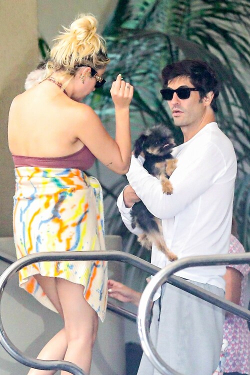 Ashley Benson and Brandon Davis step out for lunch with their puppies in Los Angeles - August 23, 2023

Who Is Ashley Benson's Fiancé? All About Brandon Davis

Ashley Benson and Brandon Davis were first linked in January 2023. They announced their engagement in July 2023

Ashley Benson and Brandon Davis are getting married!

In July 2023, Davis announced their engagement on his Instagram Story, posting a picture of Benson's massive diamond ring. Over the photo, he called Benson "Love of my life."

Benson then reshared the post, captioning it with, “My best frienddddd, I love you.”

The Pretty Little Liars actress and the oil heir first sparked romance rumors in January 2023 after they were spotted sitting courtside at a basketball game. PEOPLE confirmed their relationship in February.

"They have a lot of mutual friends and are both super fun and very social people," said a source close to the couple.

Davis, who is the grandson of billionaire oil tycoon Marvin Davis, has been making headlines long before meeting Benson. In the mid-2000s, he frequently partied with Paris Hilton and briefly dated actress Mischa Barton.

So, who is Ashley Benson's fiancé? Here's everything to know about Brandon Davis.

He is an heir to an oil fortune

The grandson of a billionaire oil tycoon, Davis is an heir to a massive fortune. His grandfather, Marvin Davis, built his wealth through lucrative business deals in both the oil and entertainment industries.

According to his 2004 New York Times obituary, the elder Davis sold his oil holdings in the early 1980s and began investing in entertainment and real estate, acquiring companies such as 20th Century Fox, Pebble Beach Company, the Aspen Skiing Company and the Beverly Hills Hotel.

He has four siblings

Davis has two brothers, Alexander and Jason, and two half-sisters, Mariella and Isabella Rickel, from his mother's second marriage.

Jason Davis, an actor best known for voicing Mikey Blumberg on the ABC animated series Recess, died from a Fentanyl overdose in February 2020 at age 35.

He dated Mischa Barton

Benson isn't Davis' first Hollywood girlfriend. In 2004, he began dating The O.C. actress Mischa Barton after they were introduced at a charity event. Their relationship lasted slightly over a year, and their breakup was confirmed in July 2005.

"They are no longer together but they remain close friends," Barton's publicist, Craig Schneider, told PEOPLE at the time.

Davis confirmed the news via his publicist Ken Sunshine, telling PEOPLE, "I wish her only the best."

He was friends with Paris Hilton

In the mid-2000s, Davis was a close friend of Paris Hilton, and the pair were often seen together at restaurants and nightclubs.

In one snap posted by Hilton in 2013, she and Davis were photographed at a Jay-Z concert along with nightclub owner Richie Akiva. "Killing it at the Jay Z Concert with my crew 🎶❤️🎶👯," Hilton captioned the photo.

He's dabbled in art curation

After his public friendship with Hilton fizzled, Davis spent several years largely out of the public eye. In 2016, he returned by launching an art pop-up in Beverly Hills. The show was titled "Malpais" and featured works by Mexican artist Bosco Sodi.

"I love Bosco's work. It reminds me of Yves Klein, an artist I grew up loving, and it has its own feel. It's unique in its own way," he told The Hollywood Reporter in 2016. "I'm just following my passion. I've been an art collector for many years. I've been transitioning into the launch of Brandon Davis Projects. I see an opportunity to bring artists that don't have representation to L.A. and to potential other cities."

He and Benson were first linked in January 2023

Davis and Benson sparked romance rumors when they sat courtside at a Los Angeles Lakers basketball game together in January 2023. The couple was seen laughing and smiling, with Davis' arm slung over Benson's leg.

They also attended a friend's birthday party together and, in early February, were photographed on a double date with actress Emma Roberts and her boyfriend Cody John, in photos obtained by Just Jared.

His relationship with Benson was confirmed in February 2023

In February 2023, PEOPLE exclusively confirmed Davis and Benson's relationship. However, the two have largely kept their relationship private.

"I usually keep my relationships private," Benson told Cosmopolitan UK in 2021, shortly after her breakup with rapper G-Eazy. "You obviously can't help if you get photographed together. [But] it's more sacred that way. Those private moments are for you and your partner, and I think it's best not to be over-exposed, and you can really protect your relationship if you're not exploiting it."

Before her relationship with the "Him & I" artist, Benson dated model and actress Cara Delevigne for two years.

He and Benson announced their engagement in July 2023

In July 2023, Davis announced the couple's engagement when he posted a photo on his Instagram Story of Benson wearing a massive diamond on her ring finger. "Love of my life," he wrote over the snap.

Benson reshared the post, writing, “My best frienddddd, I love you.”

The actress also reposted actress Theresa Picciallo’s Instagram Story, which showed Benson showing off her ring during a video call. “Our babies are getting married!!!!!!" Picciallo wrote over the snap. "@ashleybenson & @brandondavis1111, we love you both unconditionally, endlessly, forever and always. Congratulations to out best friends!!!”

people.com

#AshleyBenson