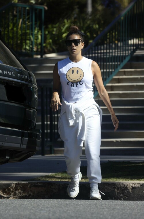 Eva Longoria | Spotted at the Park in Los Angeles - August 27, 2023

Eva Longoria enjoys some quality time with her husband and José Bastón and son Santiago, five, at the park in LA

Eva Longoria looked relaxed as she spent some time with her family in Los Angeles.

The actress, 48, who mixed and mingled at a charity function with Kim Kardashian and other celebrities on Saturday night, showcased her toned arms in a sleeveless white T-shirt with a smiley face and the initials LAFC.

The Flamin' Hot director completed her look with a pair of white jeans and sneakers.

She tied a white sweatshirt around her waist.

The Land of Women star wore her long, dark hair in a high bun and appeared to be wearing natural looking makeup.

She completed the look with a pair of dark sunglasses.

The Unplugging actress was joined by her husband, Jose Baston, 55, who looked dapper in a black sweater, joggers and sneakers.

The hem of a white T-shirt peaked beneath his sweater.

Their son, Santiago, five, looked adorable in a sky blue golf shirt and shorts.

On Sunday morning, Eva flaunted her toned curves in a jaw dropping swimsuit shot on social media.

The Texas-born beauty wore a canary yellow one-piece with a plunging halter top and French cut legs as she strolled along the beach carrying a wine glass.

She donned a yellow cover up and allowed the wind to tousle her dark locks for the shot.

The savvy businesswoman typed 'My summer secrets?' in yellow across the snap and then provided a link to the Instagram account for InMode Aesthetics.

The company provides high end skin care and treatments that include micro needling, laser treatments and other procedures.

In addition to supporting the This is About Humanity organization, which focuses on reuniting families who have been separated at the US-Mexico border, Ava has spent some of her time helping to raise money for survivors of the Maui fires.

The Casa Del Sol Tequila founder poured drinks Friday at a fundraiser in Santa Monica with proceeds going to helping Maui residents.

'What a night!' she wrote on Instagram next to a highlight video.

'I love anything that supports a good cause.'

DailyMail

#EvaLongoria