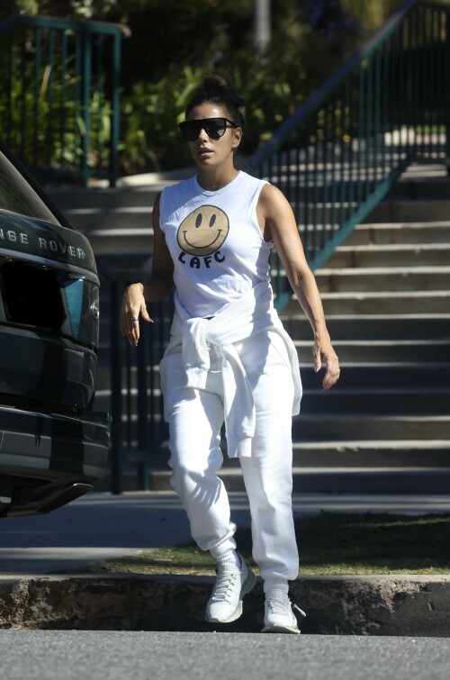 Eva Longoria | Spotted at the Park in Los Angeles - August 27, 2023

Eva Longoria enjoys some quality time with her husband and José Bastón and son Santiago, five, at the park in LA

Eva Longoria looked relaxed as she spent some time with her family in Los Angeles.

The actress, 48, who mixed and mingled at a charity function with Kim Kardashian and other celebrities on Saturday night, showcased her toned arms in a sleeveless white T-shirt with a smiley face and the initials LAFC.

The Flamin' Hot director completed her look with a pair of white jeans and sneakers.

She tied a white sweatshirt around her waist.

The Land of Women star wore her long, dark hair in a high bun and appeared to be wearing natural looking makeup.

She completed the look with a pair of dark sunglasses.

The Unplugging actress was joined by her husband, Jose Baston, 55, who looked dapper in a black sweater, joggers and sneakers.

The hem of a white T-shirt peaked beneath his sweater.

Their son, Santiago, five, looked adorable in a sky blue golf shirt and shorts.

On Sunday morning, Eva flaunted her toned curves in a jaw dropping swimsuit shot on social media.

The Texas-born beauty wore a canary yellow one-piece with a plunging halter top and French cut legs as she strolled along the beach carrying a wine glass.

She donned a yellow cover up and allowed the wind to tousle her dark locks for the shot.

The savvy businesswoman typed 'My summer secrets?' in yellow across the snap and then provided a link to the Instagram account for InMode Aesthetics.

The company provides high end skin care and treatments that include micro needling, laser treatments and other procedures.

In addition to supporting the This is About Humanity organization, which focuses on reuniting families who have been separated at the US-Mexico border, Ava has spent some of her time helping to raise money for survivors of the Maui fires.

The Casa Del Sol Tequila founder poured drinks Friday at a fundraiser in Santa Monica with proceeds going to helping Maui residents.

'What a night!' she wrote on Instagram next to a highlight video.

'I love anything that supports a good cause.'

DailyMail

#EvaLongoria