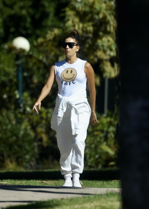 Eva Longoria | Spotted at the Park in Los Angeles - August 27, 2023

Eva Longoria enjoys some quality time with her husband and José Bastón and son Santiago, five, at the park in LA

Eva Longoria looked relaxed as she spent some time with her family in Los Angeles.

The actress, 48, who mixed and mingled at a charity function with Kim Kardashian and other celebrities on Saturday night, showcased her toned arms in a sleeveless white T-shirt with a smiley face and the initials LAFC.

The Flamin' Hot director completed her look with a pair of white jeans and sneakers.

She tied a white sweatshirt around her waist.

The Land of Women star wore her long, dark hair in a high bun and appeared to be wearing natural looking makeup.

She completed the look with a pair of dark sunglasses.

The Unplugging actress was joined by her husband, Jose Baston, 55, who looked dapper in a black sweater, joggers and sneakers.

The hem of a white T-shirt peaked beneath his sweater.

Their son, Santiago, five, looked adorable in a sky blue golf shirt and shorts.

On Sunday morning, Eva flaunted her toned curves in a jaw dropping swimsuit shot on social media.

The Texas-born beauty wore a canary yellow one-piece with a plunging halter top and French cut legs as she strolled along the beach carrying a wine glass.

She donned a yellow cover up and allowed the wind to tousle her dark locks for the shot.

The savvy businesswoman typed 'My summer secrets?' in yellow across the snap and then provided a link to the Instagram account for InMode Aesthetics.

The company provides high end skin care and treatments that include micro needling, laser treatments and other procedures.

In addition to supporting the This is About Humanity organization, which focuses on reuniting families who have been separated at the US-Mexico border, Ava has spent some of her time helping to raise money for survivors of the Maui fires.

The Casa Del Sol Tequila founder poured drinks Friday at a fundraiser in Santa Monica with proceeds going to helping Maui residents.

'What a night!' she wrote on Instagram next to a highlight video.

'I love anything that supports a good cause.'

DailyMail

#EvaLongoria