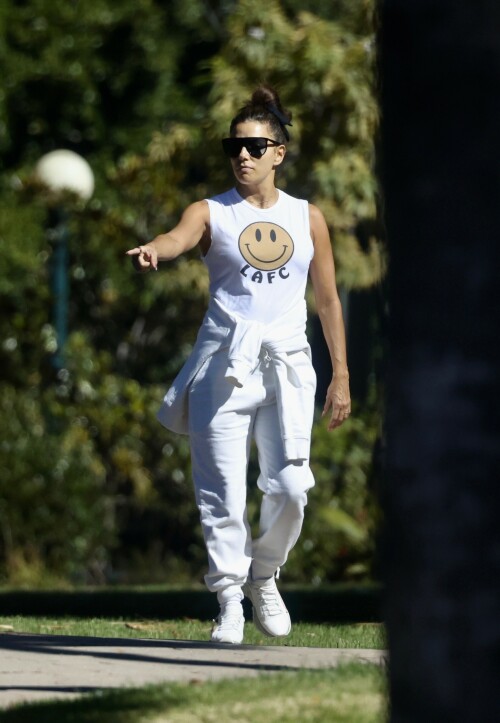 Eva Longoria | Spotted at the Park in Los Angeles - August 27, 2023

Eva Longoria enjoys some quality time with her husband and José Bastón and son Santiago, five, at the park in LA

Eva Longoria looked relaxed as she spent some time with her family in Los Angeles.

The actress, 48, who mixed and mingled at a charity function with Kim Kardashian and other celebrities on Saturday night, showcased her toned arms in a sleeveless white T-shirt with a smiley face and the initials LAFC.

The Flamin' Hot director completed her look with a pair of white jeans and sneakers.

She tied a white sweatshirt around her waist.

The Land of Women star wore her long, dark hair in a high bun and appeared to be wearing natural looking makeup.

She completed the look with a pair of dark sunglasses.

The Unplugging actress was joined by her husband, Jose Baston, 55, who looked dapper in a black sweater, joggers and sneakers.

The hem of a white T-shirt peaked beneath his sweater.

Their son, Santiago, five, looked adorable in a sky blue golf shirt and shorts.

On Sunday morning, Eva flaunted her toned curves in a jaw dropping swimsuit shot on social media.

The Texas-born beauty wore a canary yellow one-piece with a plunging halter top and French cut legs as she strolled along the beach carrying a wine glass.

She donned a yellow cover up and allowed the wind to tousle her dark locks for the shot.

The savvy businesswoman typed 'My summer secrets?' in yellow across the snap and then provided a link to the Instagram account for InMode Aesthetics.

The company provides high end skin care and treatments that include micro needling, laser treatments and other procedures.

In addition to supporting the This is About Humanity organization, which focuses on reuniting families who have been separated at the US-Mexico border, Ava has spent some of her time helping to raise money for survivors of the Maui fires.

The Casa Del Sol Tequila founder poured drinks Friday at a fundraiser in Santa Monica with proceeds going to helping Maui residents.

'What a night!' she wrote on Instagram next to a highlight video.

'I love anything that supports a good cause.'

DailyMail

#EvaLongoria