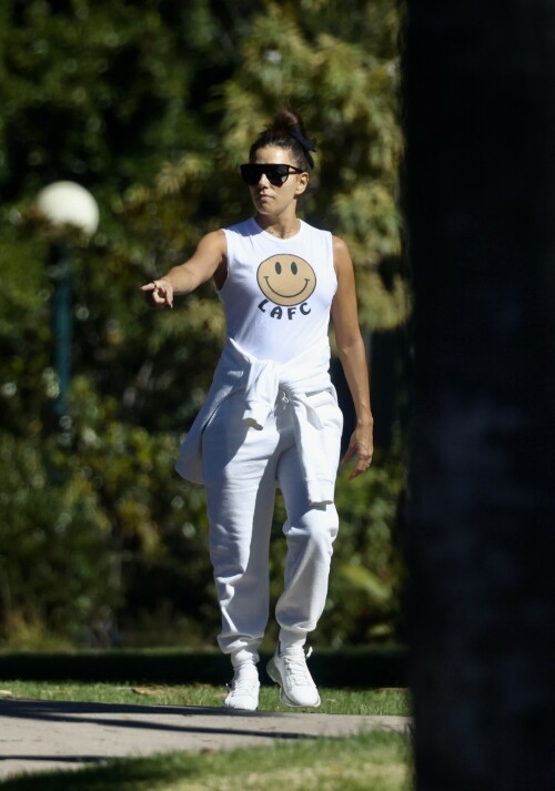 Eva Longoria | Spotted at the Park in Los Angeles - August 27, 2023

Eva Longoria enjoys some quality time with her husband and José Bastón and son Santiago, five, at the park in LA

Eva Longoria looked relaxed as she spent some time with her family in Los Angeles.

The actress, 48, who mixed and mingled at a charity function with Kim Kardashian and other celebrities on Saturday night, showcased her toned arms in a sleeveless white T-shirt with a smiley face and the initials LAFC.

The Flamin' Hot director completed her look with a pair of white jeans and sneakers.

She tied a white sweatshirt around her waist.

The Land of Women star wore her long, dark hair in a high bun and appeared to be wearing natural looking makeup.

She completed the look with a pair of dark sunglasses.

The Unplugging actress was joined by her husband, Jose Baston, 55, who looked dapper in a black sweater, joggers and sneakers.

The hem of a white T-shirt peaked beneath his sweater.

Their son, Santiago, five, looked adorable in a sky blue golf shirt and shorts.

On Sunday morning, Eva flaunted her toned curves in a jaw dropping swimsuit shot on social media.

The Texas-born beauty wore a canary yellow one-piece with a plunging halter top and French cut legs as she strolled along the beach carrying a wine glass.

She donned a yellow cover up and allowed the wind to tousle her dark locks for the shot.

The savvy businesswoman typed 'My summer secrets?' in yellow across the snap and then provided a link to the Instagram account for InMode Aesthetics.

The company provides high end skin care and treatments that include micro needling, laser treatments and other procedures.

In addition to supporting the This is About Humanity organization, which focuses on reuniting families who have been separated at the US-Mexico border, Ava has spent some of her time helping to raise money for survivors of the Maui fires.

The Casa Del Sol Tequila founder poured drinks Friday at a fundraiser in Santa Monica with proceeds going to helping Maui residents.

'What a night!' she wrote on Instagram next to a highlight video.

'I love anything that supports a good cause.'

DailyMail

#EvaLongoria