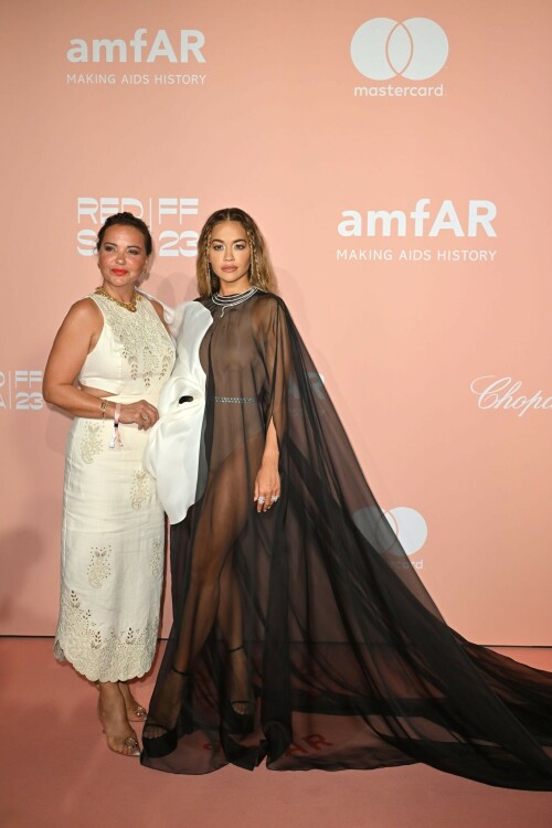 Rita Ora attends the amfAR gala Venezia 2023 presented The Red Sea International Film Festival - September 3, 2023

Rita Ora Soars in Platform Sandals at amfAR Gala Venezia 2023



Rita Ora made a dynamic arrival on the red carpet for this year’s amfAR Gala Venezia.

While in Venice, Italy for the Sunday night occasion during the 2023 Venice Film Festival, Ora — who is one of the event’s featured musical performers, alongside Leona Lewis — hit the red carpet in a set of sleek black sandals. The “Let You Love Me” singer’s style featured an ankle-strapped silhouette, set atop thick platform soles for a sharp height boost.

Ora’s shoes also earned added height from their towering heels — which appeared to total anywhere from 5 to 6 inches in height. Though the pair’s shape couldn’t be seen, they likely featured a stiletto or block shape, similar to the numerous pairs Ora has previously worn to formal occasions over the years.

The set also brought a burst of elevation to the musician’s outfit: a sheer black dress in a caped silhouette, which featured a floor-length hem that flowed into a dramatic, lengthy train. The dynamic piece included a flared white silk accent on its bodice, shaped like a large, abstract flower for added drama. For fuller coverage, it was also layered over a matte nude sleeveless bodysuit, cinched by a crystal-covered belt for a sprinkle of glamour.

Ora’s attire for the gala was complete with a sparkling collar necklace, which featured several thin tiers that swirled as if wrapping around her neck. The diamond-coated piece was complemented with equally sparkly diamond cocktail rings for a glittering finish.

The Venice Film Festival will feature international movies and cinematic shorts debuting for the new season. The 80th annual event is also taking place during the SAG-AFTRA strike, which has current interim agreements to allow U.S. actors to appear at the occasion. Aside from numerous premieres — including “Maestro,” “Priscilla” and “Ferrari” — the week will conclude with its starry amFar Gala, featuring performances by Leona Lewis and Rita Ora.

Aaron Royce - Footwear News

#RitaOra