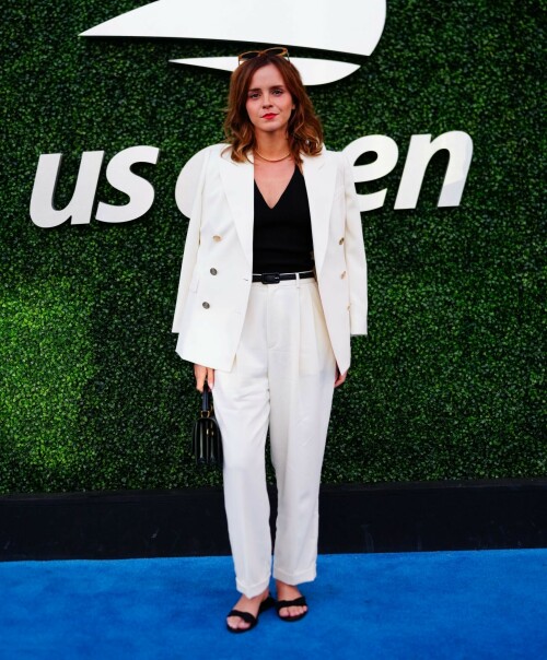 Emma Watson attends the 2023 US Open Tennis Championships in NY - September 5, 2023

Emma Watson weaves her magic on Anna Wintour! Spellbinding Harry Potter star makes Vogue boss crack a rare smile at the 2023 US Open Tennis Championships in New York City

Emma Watson served up a chic look for the 2023 US Open Tennis Championships in New York City on Tuesday.

The 33-year-old cut a seriously stylish figure in an eye-catching white suit and black vest while watching Karolina Muchova of the Czech Republic defeat Sorana Cirstea, of Romania, during the quarterfinals.

And it's a good thing the Harry Potter star brought her fashion A-game - she was seated alongside Vogue boss Anna Wintour.

The actress certainly managed to weave her magic on the notoriously aloof magazine icon, with Wintour cracking a rare smile and even a chuckle while the pair chatted away courtside.

Of course, the pair have crossed paths many times before with Emma chalking up numerous British Vogue and international Vogue covers during her hugely successful career.

The 73-year-old media executive donned an eye-catching white-and-green sleeved dress at the sporting event.

The longtime Editor-In-Chief of Vogue added another element of brightness to her look with a white leather belt.

The fashion industry mainstay also accessorized with a set of sparkling necklaces.

Wintour donned a pair of jet-black sunglasses, which contrasted perfectly with the bright tones of her clothing.

Her platinum blonde hair fell towards her shoulders while she spent time at the tournament.

Elsewhere at the star-studded event, Chloe Grace Moretz opted for a graphic-printed navy blue t-shirt during the championships.

The 26-year-old performer paired her top with a set of wide-framed sunglasses.

The Dark Shadows actress gave her outfit a bit of metallic shine with a set of earrings.

Moretz was also seated next to her girlfriend, Kate Harrison, for the duration of the sporting event.

The 32-year-old model showed off her sculpted arms while wearing a white undershirt.

The social media personality added an element of darkness to her look with a black crossbody bag.

Her dark brunette hair cascaded onto her shoulders and chest as she spent time at the tournament.

J Balvin stood out while wearing a bright pink polo shirt during the annual sporting event.

The 38-year-old musician paired his top with an equally eye-catching pair of pants.

DailyMail

#EmmaWatson