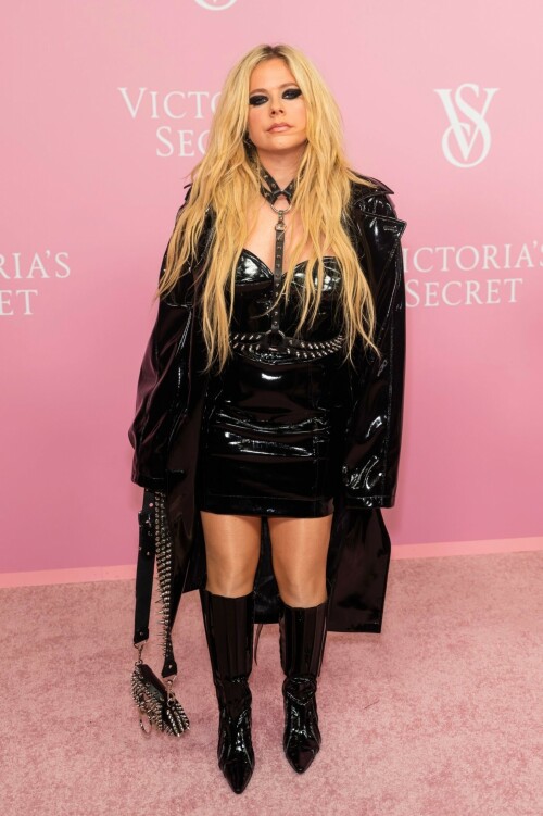 Avril Lavigne | Victoria's Secret Celebrates The Tour '23 at The Manhattan Center New York City - September 6, 2023

Avril Lavigne is a 'Canadian queen' in latest punk photos from New York: 'A goddess'

The "Complicated" songstress walked the pink carpet at the Victoria's Secret World Tour in Manhattan.

Avril Lavigne is bringing a touch of punk south of the border.

The 38-year-old Canadian songstress took to Instagram on Wednesday with a carousel of photos taken inside a vehicle as she visited New York.

In the first shot, the "Complicated" and "Girlfriend" singer posed while sitting on one of the seats, as she dangled a wine glass in her left hand. Lavigne rocked an all-black shiny leather look, which included a long jacket and a strapless mini dress. She paired the fit with a matching studded mini bag, knee-high boots and a studded choker body piece.

Photographed by Tyler Kenny, styled by Lyn Alyson and glammed up by makeup artist Julia Dantas, Lavigne stepped out in style as she kicked off New York Fashion Week.

"NYC baby," the singer captioned her post on Instagram, along with two white heart emojis.

Fellow celebrities and fans showed their appreciation for Lavigne's stunning beauty and edgy style in the comments section.

"Canadian queen," shared fellow Ontario-born icon, model Winnie Harlow.

"Hottest rockstar of the century," one fan wrote.

"God, you're gorgeous, and I love you. Love from Brazil," another added.

"Avril, you look like you throw the best parties," someone raved.

"Literally stunning, Av," someone else penned.

"Looking hot as ever!!" a fan chimed in.

Lavigne wore the chic look at Victoria's Secret's event on Wednesday at the Manhattan Center, ahead of New York Fashion Week, which runs from Sept. 7 to 13 this year.

The lingerie brand held its special event, which included a star-studded pink carpet, to celebrate the upcoming release of "The Victoria's Secret World Tour" on Sept. 26. Releasing on Prime Video, it's the return of the brand's iconic fashion show, this time a feature-length film.

Naomi Campbell, Gigi Hadid, Adriana Lima and Priyanka Chopra were among the celebrities who attended the event. But some Canadians might be most excited to see Lavigne pose beside her Ontario-born sister, model Winnie Harlow, who also made an appearance at the event.

news.yahoo.com

#AvrilLavigne