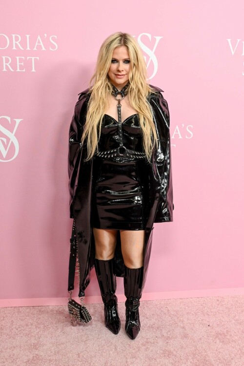 Avril Lavigne | Victoria's Secret Celebrates The Tour '23 at The Manhattan Center New York City - September 6, 2023

Avril Lavigne is a 'Canadian queen' in latest punk photos from New York: 'A goddess'

The "Complicated" songstress walked the pink carpet at the Victoria's Secret World Tour in Manhattan.

Avril Lavigne is bringing a touch of punk south of the border.

The 38-year-old Canadian songstress took to Instagram on Wednesday with a carousel of photos taken inside a vehicle as she visited New York.

In the first shot, the "Complicated" and "Girlfriend" singer posed while sitting on one of the seats, as she dangled a wine glass in her left hand. Lavigne rocked an all-black shiny leather look, which included a long jacket and a strapless mini dress. She paired the fit with a matching studded mini bag, knee-high boots and a studded choker body piece.

Photographed by Tyler Kenny, styled by Lyn Alyson and glammed up by makeup artist Julia Dantas, Lavigne stepped out in style as she kicked off New York Fashion Week.

"NYC baby," the singer captioned her post on Instagram, along with two white heart emojis.

Fellow celebrities and fans showed their appreciation for Lavigne's stunning beauty and edgy style in the comments section.

"Canadian queen," shared fellow Ontario-born icon, model Winnie Harlow.

"Hottest rockstar of the century," one fan wrote.

"God, you're gorgeous, and I love you. Love from Brazil," another added.

"Avril, you look like you throw the best parties," someone raved.

"Literally stunning, Av," someone else penned.

"Looking hot as ever!!" a fan chimed in.

Lavigne wore the chic look at Victoria's Secret's event on Wednesday at the Manhattan Center, ahead of New York Fashion Week, which runs from Sept. 7 to 13 this year.

The lingerie brand held its special event, which included a star-studded pink carpet, to celebrate the upcoming release of "The Victoria's Secret World Tour" on Sept. 26. Releasing on Prime Video, it's the return of the brand's iconic fashion show, this time a feature-length film.

Naomi Campbell, Gigi Hadid, Adriana Lima and Priyanka Chopra were among the celebrities who attended the event. But some Canadians might be most excited to see Lavigne pose beside her Ontario-born sister, model Winnie Harlow, who also made an appearance at the event.

news.yahoo.com

#AvrilLavigne