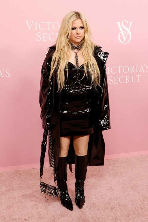 Avril Lavigne | Victoria's Secret Celebrates The Tour '23 at The Manhattan Center New York City - September 6, 2023

Avril Lavigne is a 'Canadian queen' in latest punk photos from New York: 'A goddess'

The "Complicated" songstress walked the pink carpet at the Victoria's Secret World Tour in Manhattan.

Avril Lavigne is bringing a touch of punk south of the border.

The 38-year-old Canadian songstress took to Instagram on Wednesday with a carousel of photos taken inside a vehicle as she visited New York.

In the first shot, the "Complicated" and "Girlfriend" singer posed while sitting on one of the seats, as she dangled a wine glass in her left hand. Lavigne rocked an all-black shiny leather look, which included a long jacket and a strapless mini dress. She paired the fit with a matching studded mini bag, knee-high boots and a studded choker body piece.

Photographed by Tyler Kenny, styled by Lyn Alyson and glammed up by makeup artist Julia Dantas, Lavigne stepped out in style as she kicked off New York Fashion Week.

"NYC baby," the singer captioned her post on Instagram, along with two white heart emojis.

Fellow celebrities and fans showed their appreciation for Lavigne's stunning beauty and edgy style in the comments section.

"Canadian queen," shared fellow Ontario-born icon, model Winnie Harlow.

"Hottest rockstar of the century," one fan wrote.

"God, you're gorgeous, and I love you. Love from Brazil," another added.

"Avril, you look like you throw the best parties," someone raved.

"Literally stunning, Av," someone else penned.

"Looking hot as ever!!" a fan chimed in.

Lavigne wore the chic look at Victoria's Secret's event on Wednesday at the Manhattan Center, ahead of New York Fashion Week, which runs from Sept. 7 to 13 this year.

The lingerie brand held its special event, which included a star-studded pink carpet, to celebrate the upcoming release of "The Victoria's Secret World Tour" on Sept. 26. Releasing on Prime Video, it's the return of the brand's iconic fashion show, this time a feature-length film.

Naomi Campbell, Gigi Hadid, Adriana Lima and Priyanka Chopra were among the celebrities who attended the event. But some Canadians might be most excited to see Lavigne pose beside her Ontario-born sister, model Winnie Harlow, who also made an appearance at the event.

news.yahoo.com

#AvrilLavigne