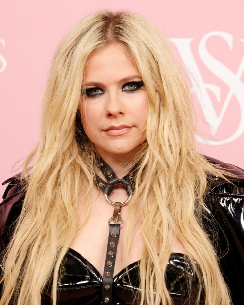 Avril Lavigne | Victoria's Secret Celebrates The Tour '23 at The Manhattan Center New York City - September 6, 2023

Avril Lavigne is a 'Canadian queen' in latest punk photos from New York: 'A goddess'

The "Complicated" songstress walked the pink carpet at the Victoria's Secret World Tour in Manhattan.

Avril Lavigne is bringing a touch of punk south of the border.

The 38-year-old Canadian songstress took to Instagram on Wednesday with a carousel of photos taken inside a vehicle as she visited New York.

In the first shot, the "Complicated" and "Girlfriend" singer posed while sitting on one of the seats, as she dangled a wine glass in her left hand. Lavigne rocked an all-black shiny leather look, which included a long jacket and a strapless mini dress. She paired the fit with a matching studded mini bag, knee-high boots and a studded choker body piece.

Photographed by Tyler Kenny, styled by Lyn Alyson and glammed up by makeup artist Julia Dantas, Lavigne stepped out in style as she kicked off New York Fashion Week.

"NYC baby," the singer captioned her post on Instagram, along with two white heart emojis.

Fellow celebrities and fans showed their appreciation for Lavigne's stunning beauty and edgy style in the comments section.

"Canadian queen," shared fellow Ontario-born icon, model Winnie Harlow.

"Hottest rockstar of the century," one fan wrote.

"God, you're gorgeous, and I love you. Love from Brazil," another added.

"Avril, you look like you throw the best parties," someone raved.

"Literally stunning, Av," someone else penned.

"Looking hot as ever!!" a fan chimed in.

Lavigne wore the chic look at Victoria's Secret's event on Wednesday at the Manhattan Center, ahead of New York Fashion Week, which runs from Sept. 7 to 13 this year.

The lingerie brand held its special event, which included a star-studded pink carpet, to celebrate the upcoming release of "The Victoria's Secret World Tour" on Sept. 26. Releasing on Prime Video, it's the return of the brand's iconic fashion show, this time a feature-length film.

Naomi Campbell, Gigi Hadid, Adriana Lima and Priyanka Chopra were among the celebrities who attended the event. But some Canadians might be most excited to see Lavigne pose beside her Ontario-born sister, model Winnie Harlow, who also made an appearance at the event.

news.yahoo.com

#AvrilLavigne