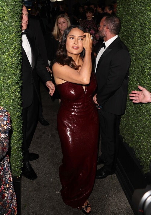 Salma Hayek - Kering Hosts 2nd Annual Caring for Women in New York - September 12, 2023

Salma Hayek oozes glamour in a plunging sequinned burgundy gown as she attends the Caring For Women charity dinner

Salma Hayek was sure to turn heads as she put on a very glamorous display at the Kering Foundation's second annual Caring For Women Dinner in New York on Tuesday, held to raise money for domestic abuse survivors.

The actress, 57, dazzled in a plunging sequinned burgundy gown as she graced the black carpet at the charity gala held to raise money for domestic abuse survivors.

Salma was sure to look her best for the star-studded event, as she posed this way and that in the figure-hugging dress which featured a split at the leg.

The Frida star accessorised her glam look with black heels and a coordinating clutch bag, finishing things off with silver drop earrings.

Salma was in good company as she posed alongside longtime husband and Kering CEO François-Henri Pinault, 61, who looked dapper in a black suit.

Pinault is chairman of the Kering Foundation and his wife Hayek is on the board of directors.

The second annual Caring For Women dinner is presented by the Kering Foundation — the leading foundation combatting the epidemic that is violence against women and girls.

It is a celebration of the charitable organization's 15th anniversary and the theme of the evening was 'strength in numbers,' as per WWD.

Hayek and Pinault co-chaired the event with the likes of supermodel Christy Turlington, Olivia Wilde and Zoe Kravitz among others.

This year's star-studded dinner benefitted organizations that 'address gender-based violence.'

'Despite alarming setbacks in women's rights around the world, there has been heartening progress to address violence against women in the last 15 years, and we must continue to harness the power of collaboration and solidarity to ensure that all women can lead fulfilling lives free from violence,' Pinault said in a statement head of Tuesday's soiree.

Salma's outing comes days after she proved age is just a number while showcasing her age-defying figure in a black and white patterned bikini.

In her latest Instagram post, the 57-year-old Oscar nominee looked nothing short of sensational in a flowy light blue cover-up as she cruised around on the ocean on a yacht.

As she posed, with windswept hair and a coy smile, the House of Gucci star placed one hand on her right hip and gave the camera her best smoldering stare.

'What’s wrong with Sunday blues?' she captioned the photo, which received more than 351,695 likes in just six hours.

Her latest post comes after gushing to fans that she is 'so happy to be alive and so profoundly grateful for all the blessings.'

'My beloved family, my precious friends, my health, my work that keeps me going, my empowering team, my relationship with animals & nature, and the love of all my loyal fans,' she captioned a sexy slideshow of snaps of her at the beach.

She concluded: 'Happy 57th birthday to me!!!'

DailyMail

#SalmaHayek